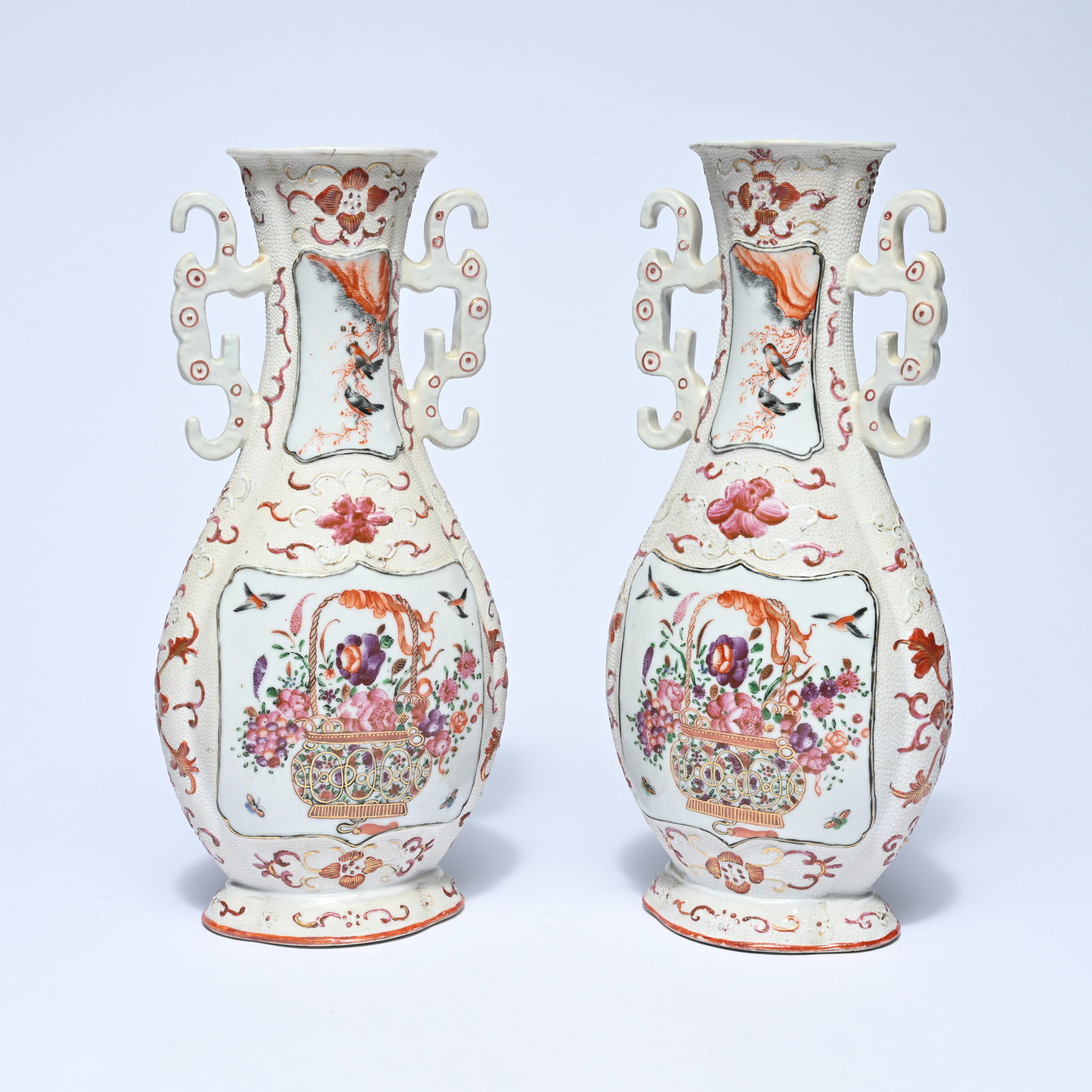 Pair of Chinese porcelain vases with double openwork handles, richly decorated in polychrome with (1 of 8)