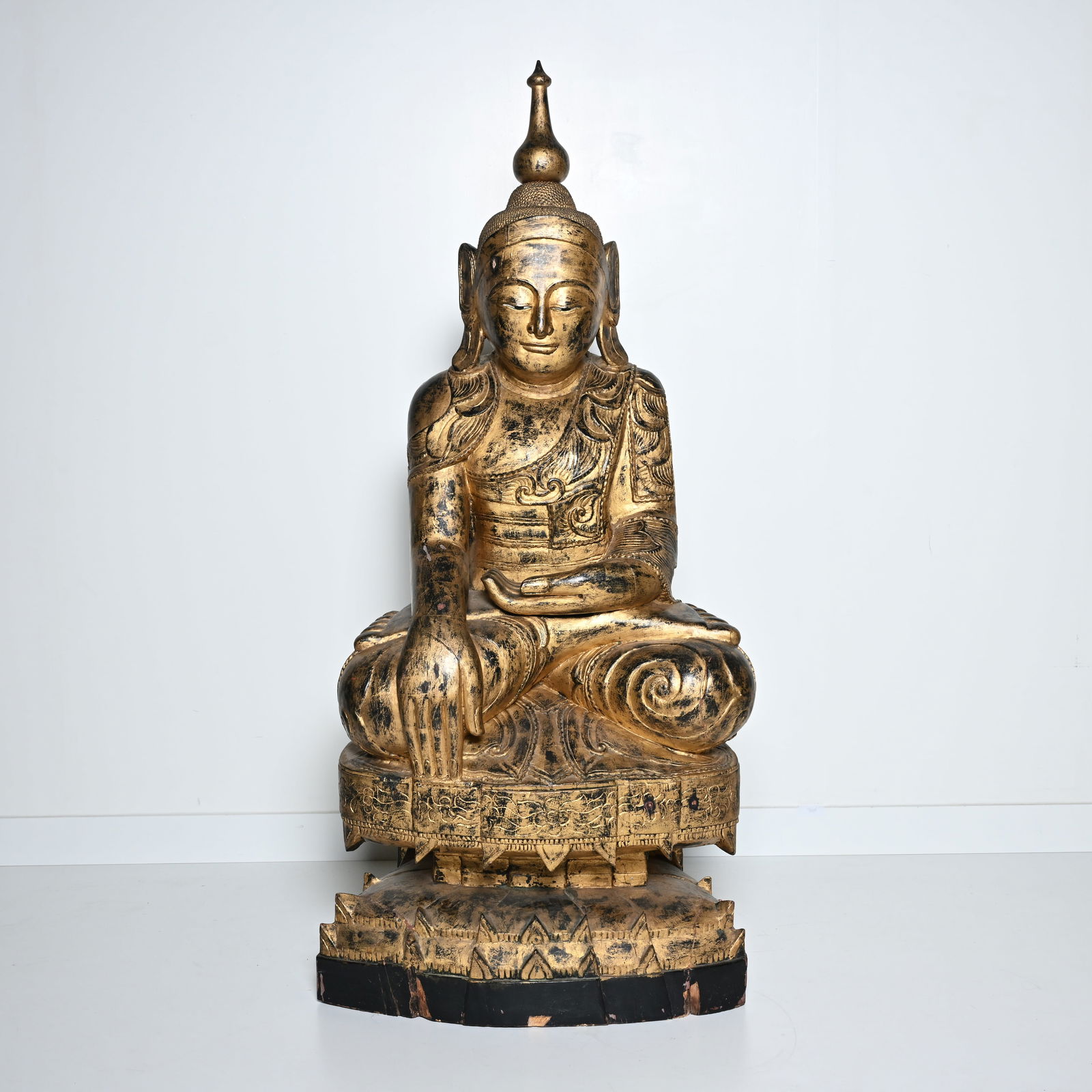 Large Burmese Shakyamuni Buddha carved and gilded in wood, sitting in meditation posture on a richly (1 of 7)