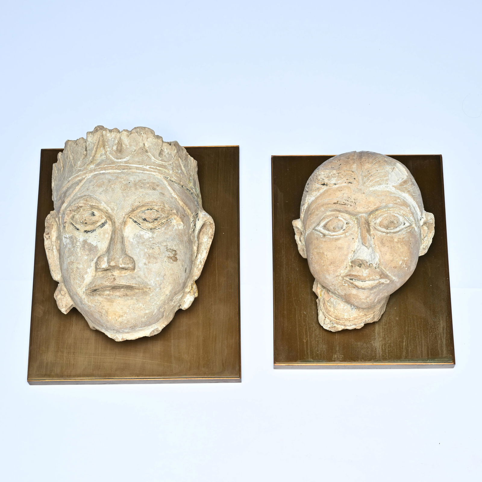 Two South Asian stone heads in sandstone, with traces of pigment. Probably North India (1 of 8)