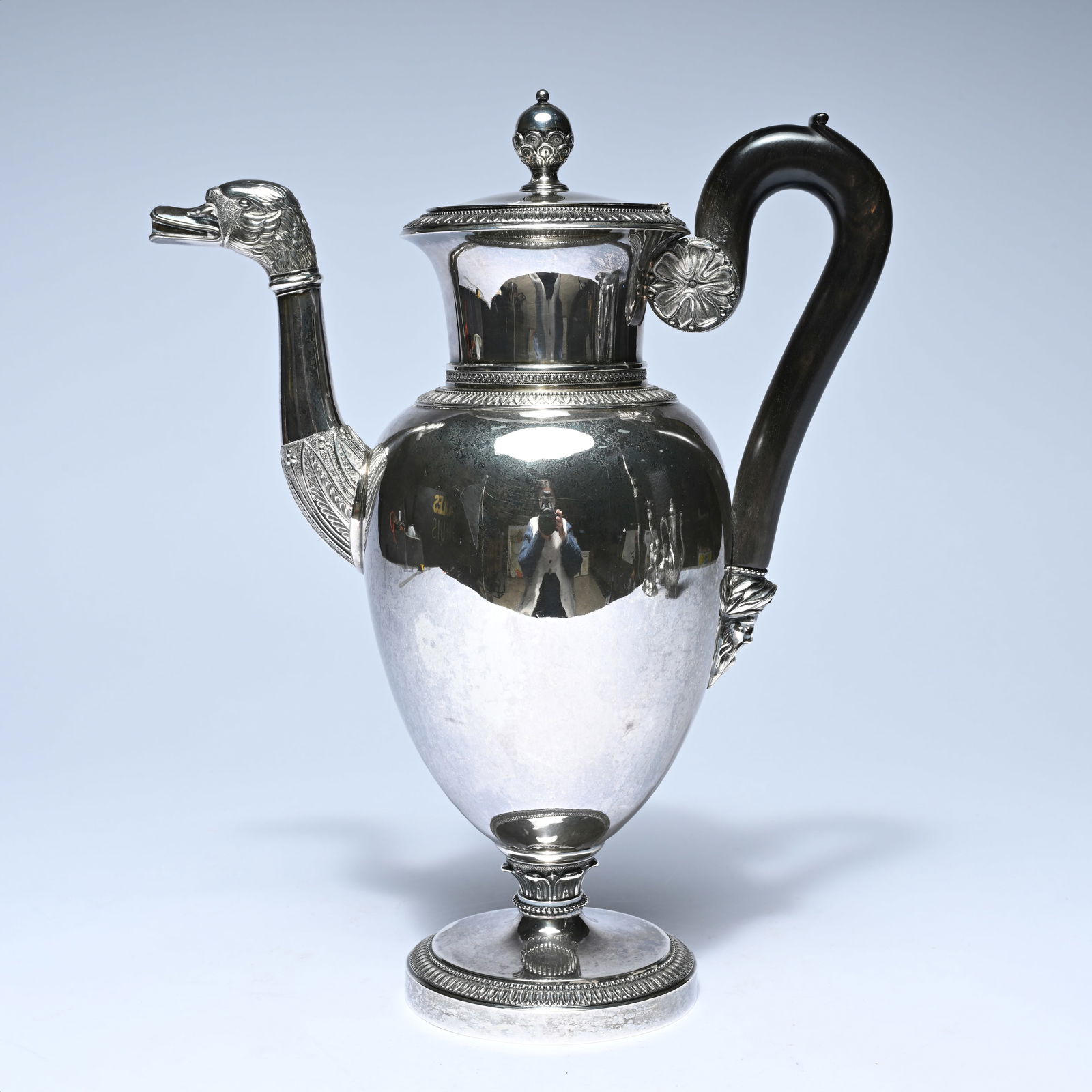 Silver jug with a pear-shaped body on a round foot, featuring a richly sculpted spout in the shape (1 of 7)