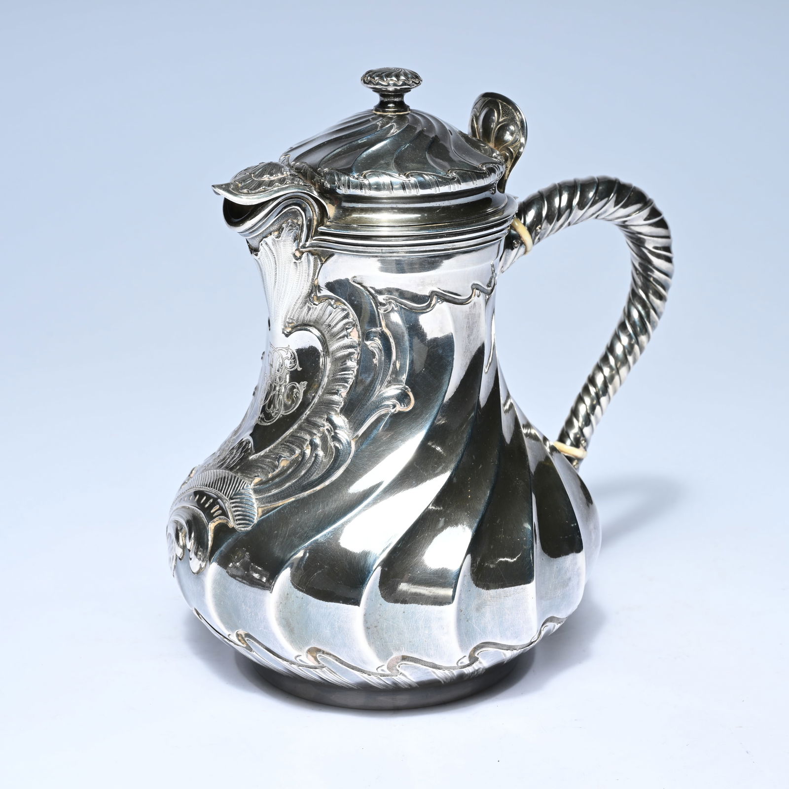 Silver jug, Maison Odiot, Paris, with a pear-shaped, fluted body and rich relief decoration. The (1 of 9)