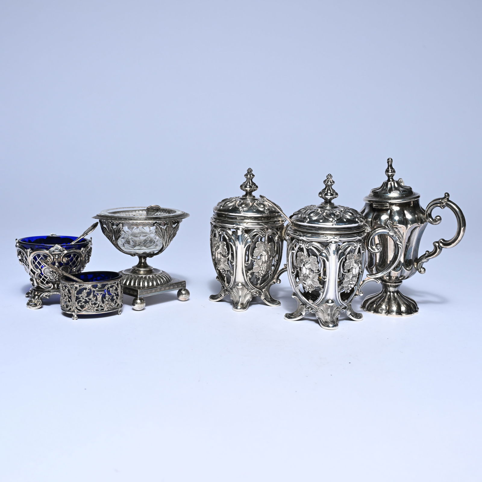 3 silver mustard pots, a crystal salt coupe on a silver base and two silver salt cellars with blue (1 of 20)