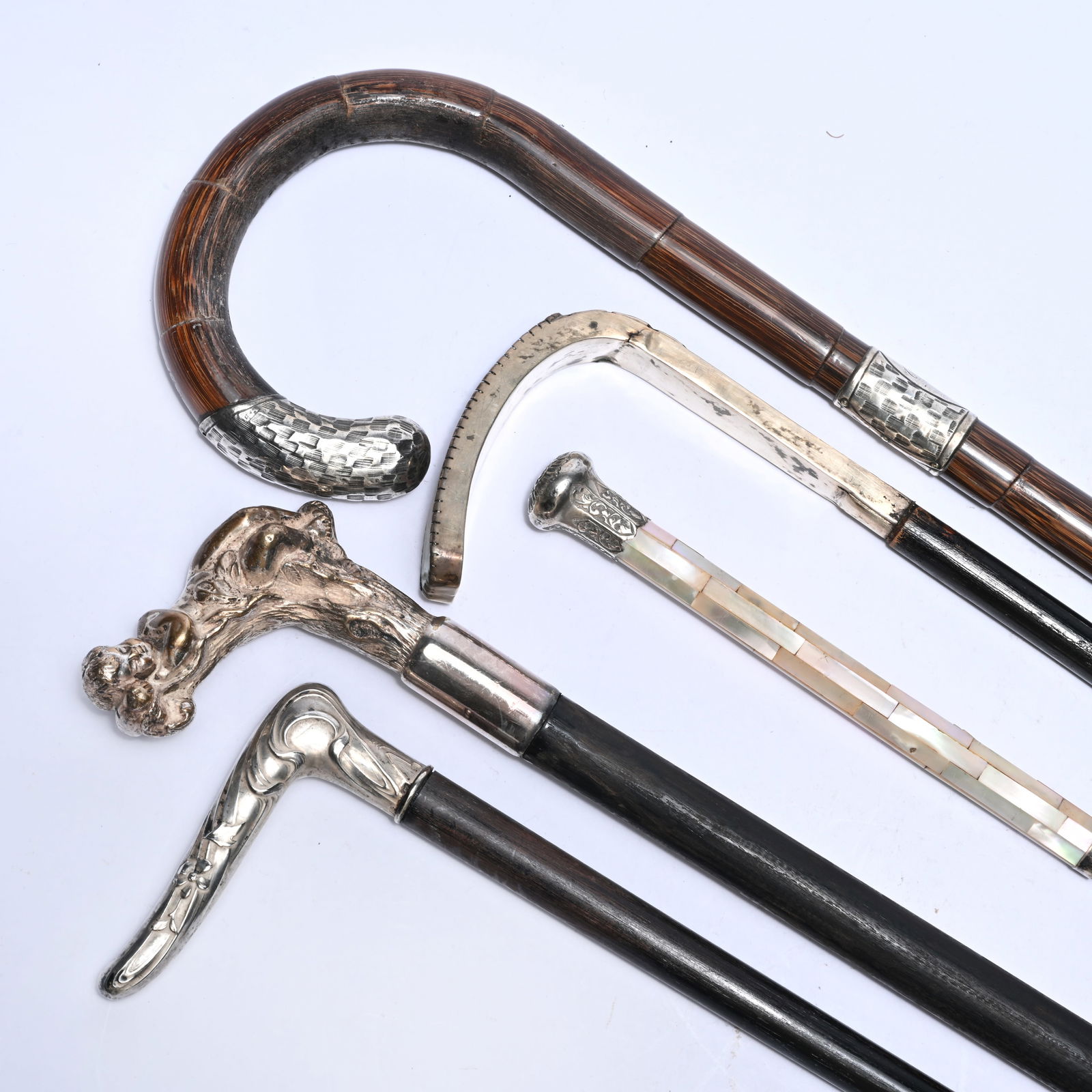 5 wooden walking sticks with decorative finishes in silver and mother of pearl (1 of 5)