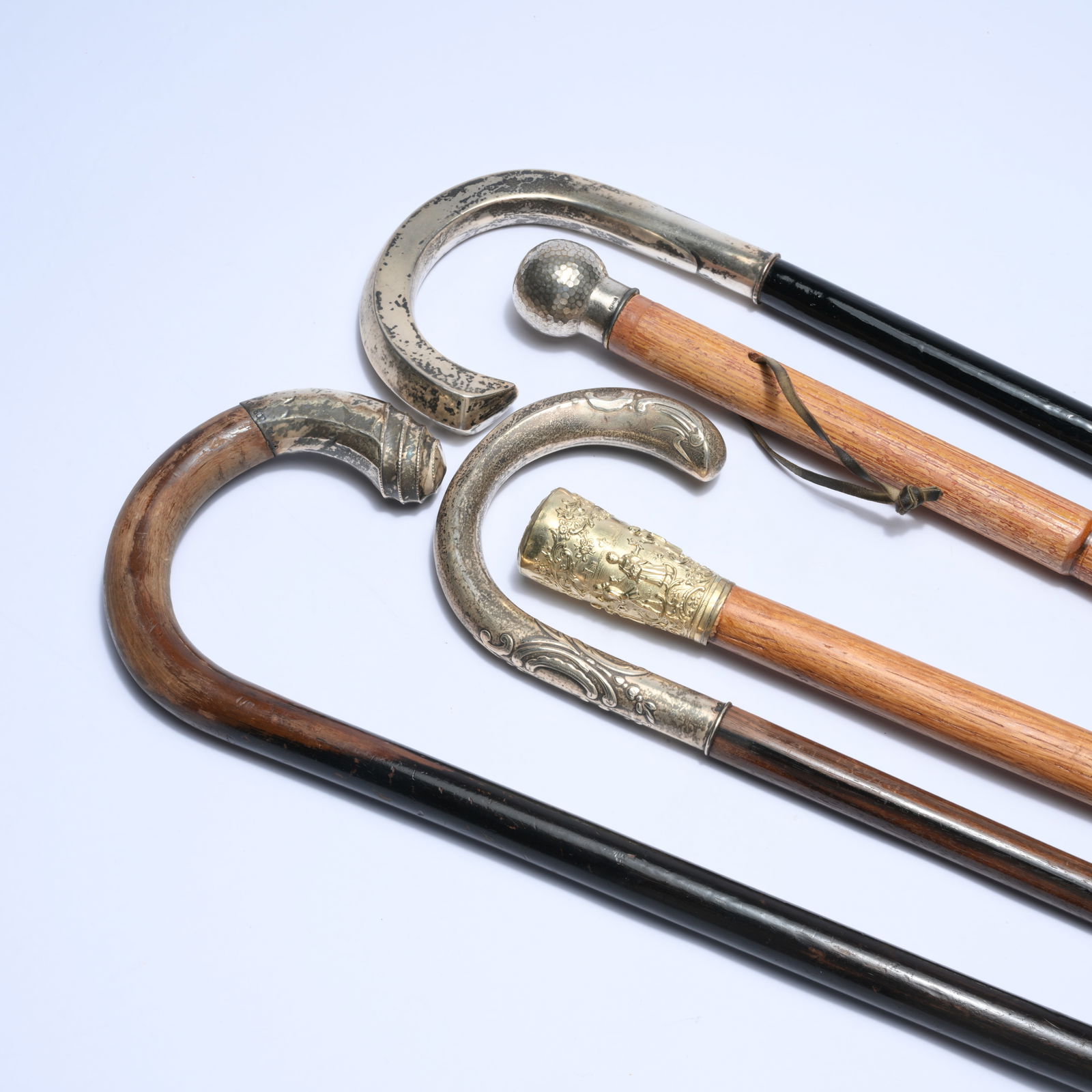 5 walking sticks with wooden shafts and curved silver crutch handles (3) and knob crutch grips (2) (1 of 6)