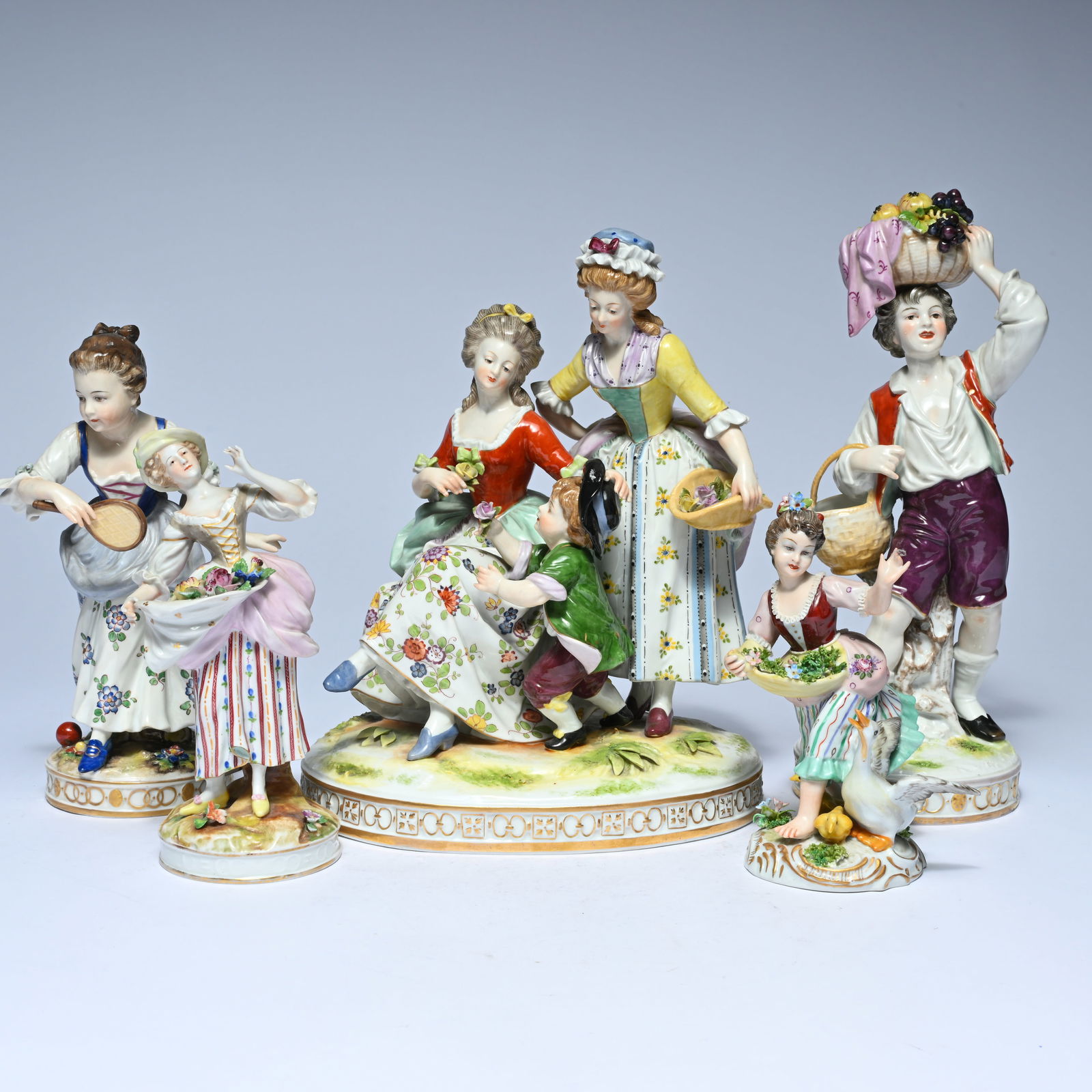 A collection of polychrome porcelain figures and figure groups, Capo di Monti and Germany, probably (1 of 12)