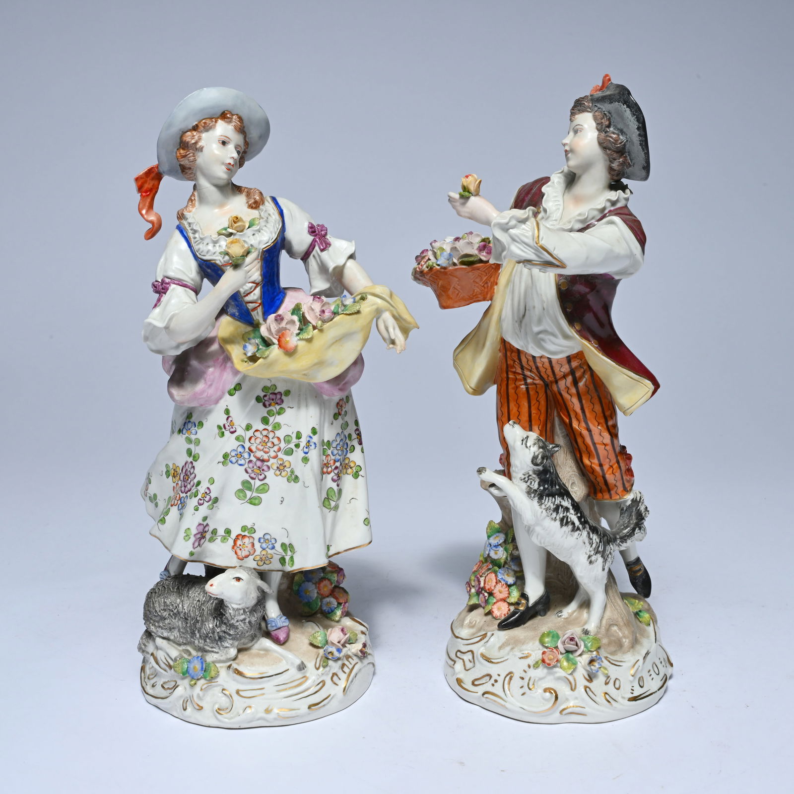 Pair of polychrome porcelain figurines of a boy and a girl with a flower basket, Germany, (1 of 5)