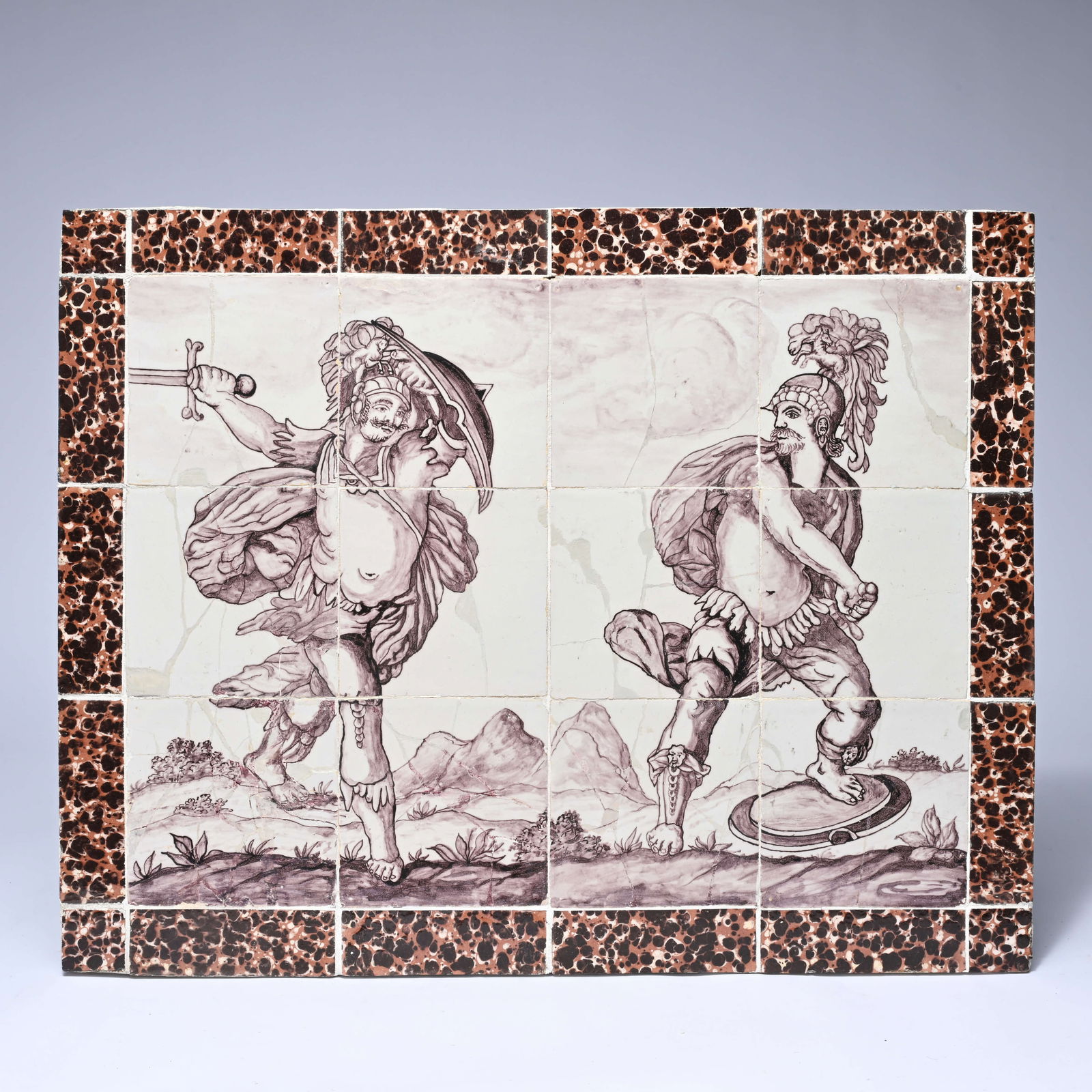 Delft 18th century manganese tile tableau depicting two Roman soldiers: Delft 18th century manganese tile tableau depicting two Roman soldiersDelfts 18e eeuwse mangaantegeltableau met voorstelling van 2 Romeinse soldaten61 x 49 cm