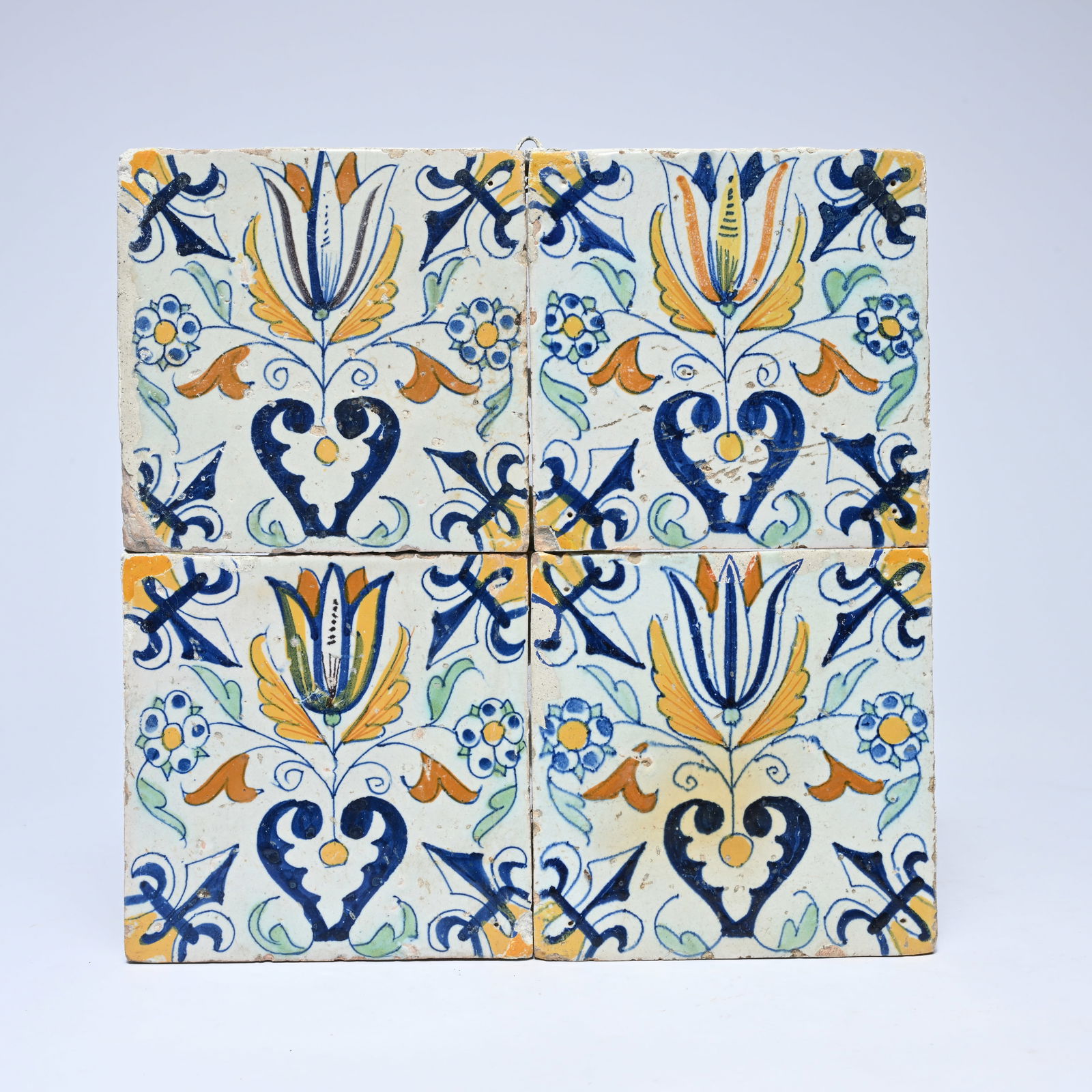 4 17th-century polychrome Dutch tiles, decorated with tulips and a fleur-de-lis corner motif (1 of 2)