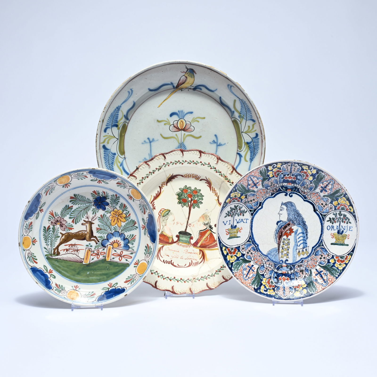 4 polychrome plates in Delftware, among others one plate (heavily damaged) is English (1780s) and (1 of 9)