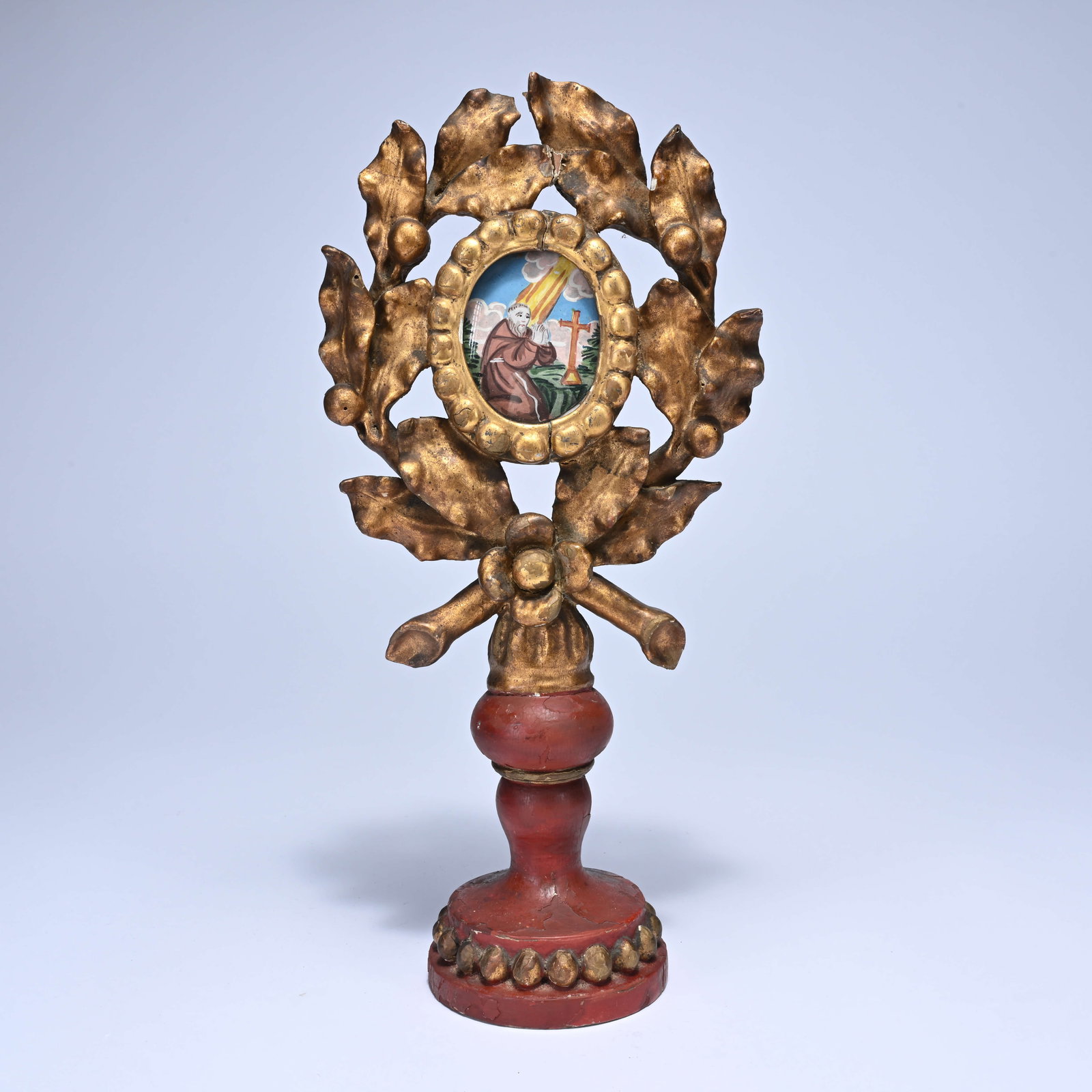 Polychrome and gilded 18th century wooden reliquary in the shape of a laurel wreath with a colored (1 of 6)