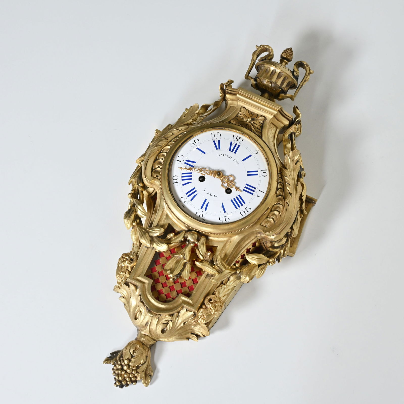 French cartel clock in richly gilded bronze, executed in Louis XV style with lavish rocailles, (1 of 6)