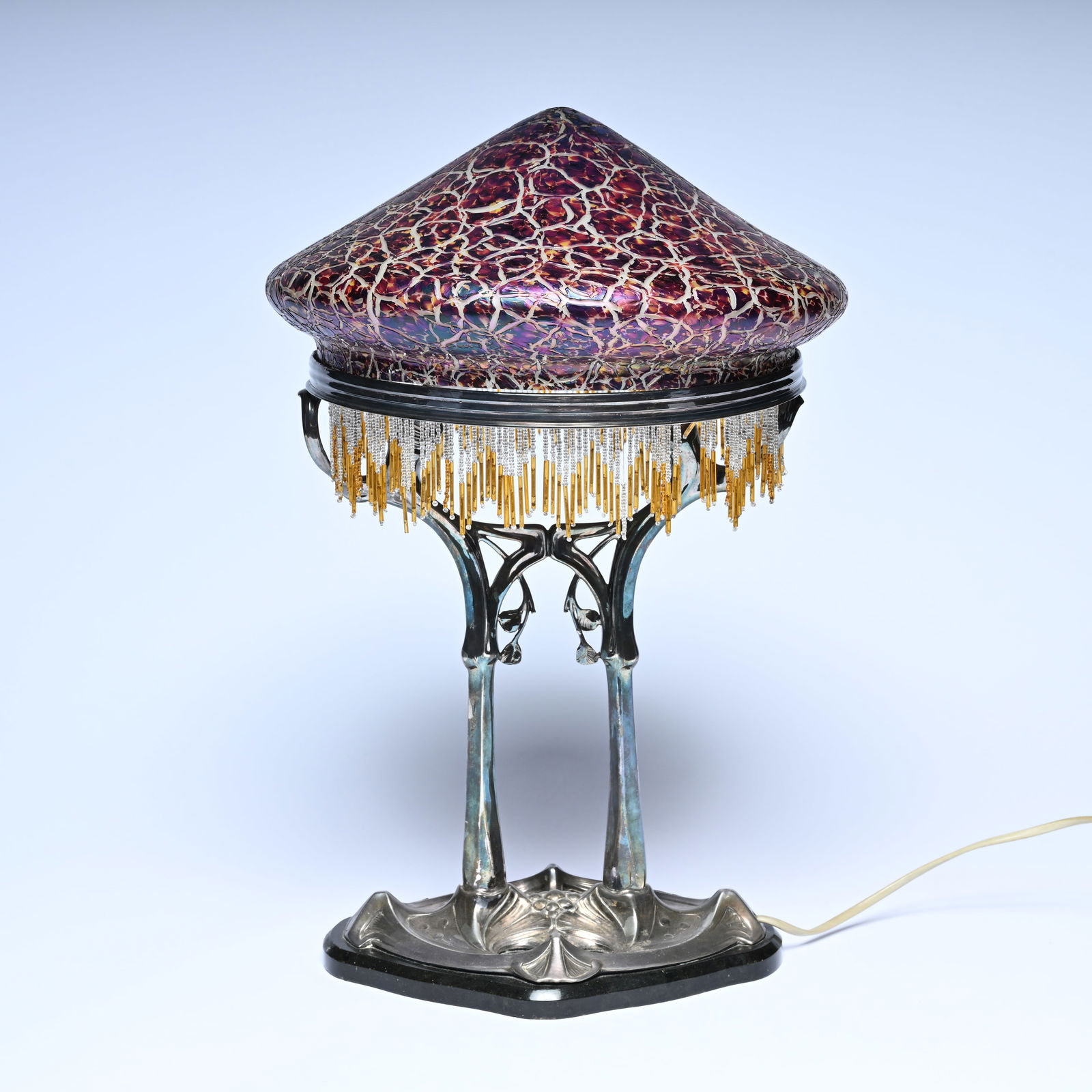 Art Nouveau Loetz table lamp, Austria, ca. 1900, iridescent glass shade with crackle decor, on an (1 of 6)