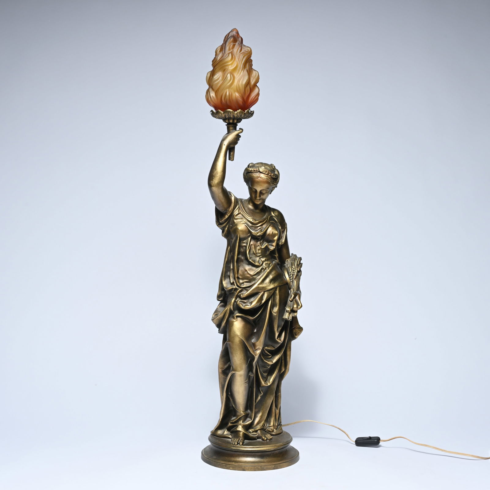 Graceful monumental figural lamp in bronze-colored metal, designed as a classically draped woman (1 of 7)