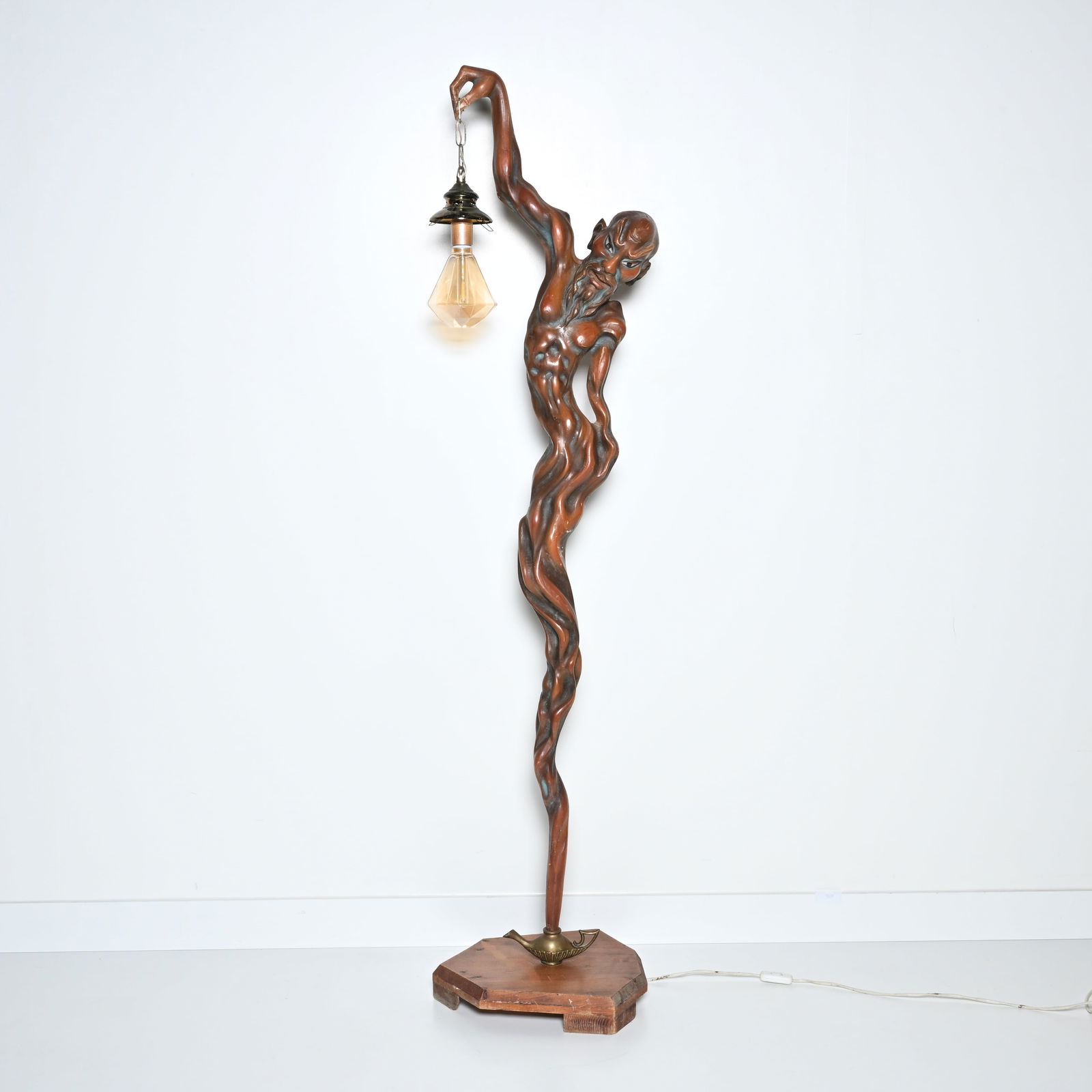 Art Deco floor lamp in burl wood depicting a spirit emerging from an oil lamp (1 of 5)