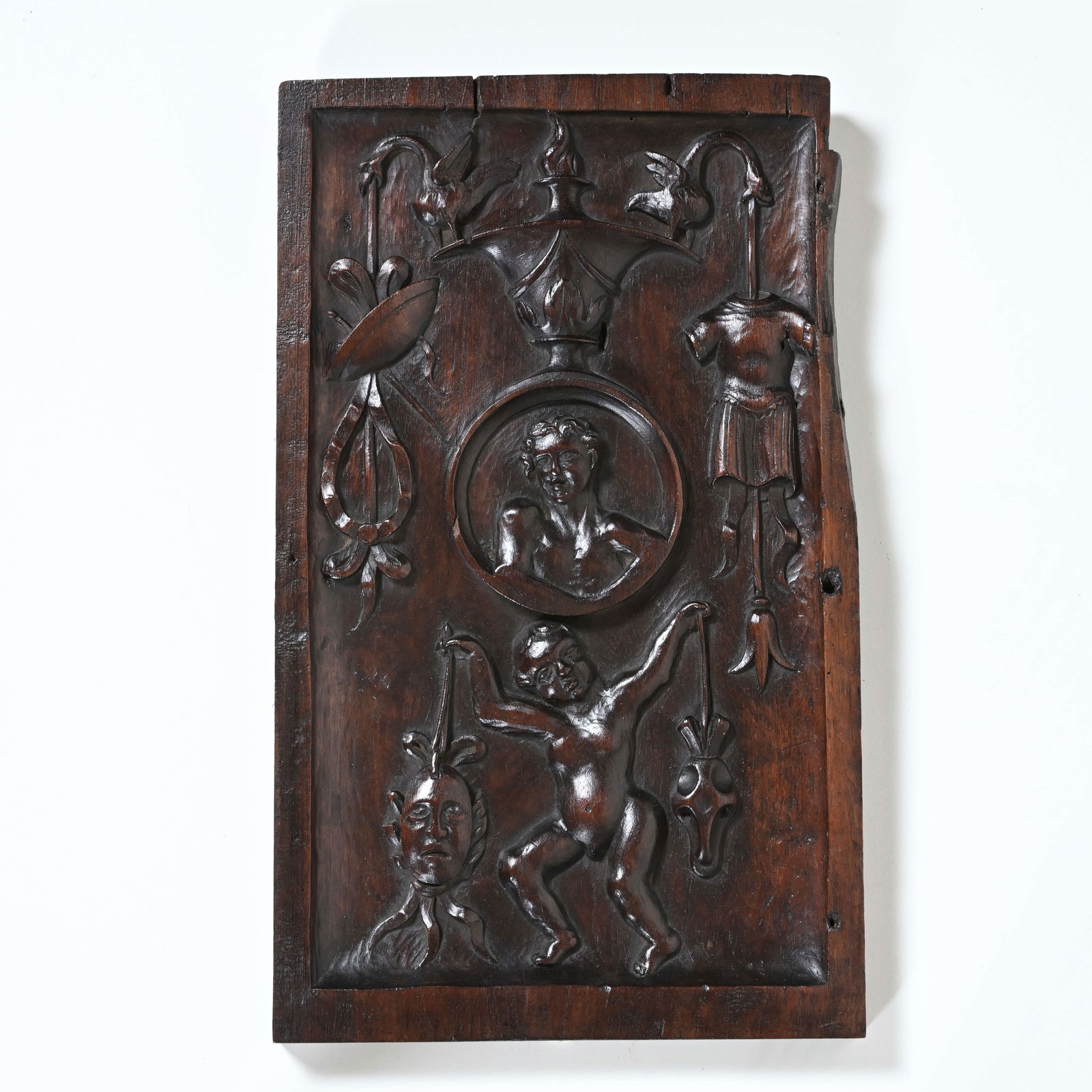 Antique wooden panel with carnival figures and masks. Southern Netherlands, c. 1600. Presumably from: Antique wooden panel with carnival figures and masks. Southern Netherlands, c. 1600. Presumably from a bourgeois interior or a guild house.Antiek houten paneel met carnavaleske figuren en maskers. Zui