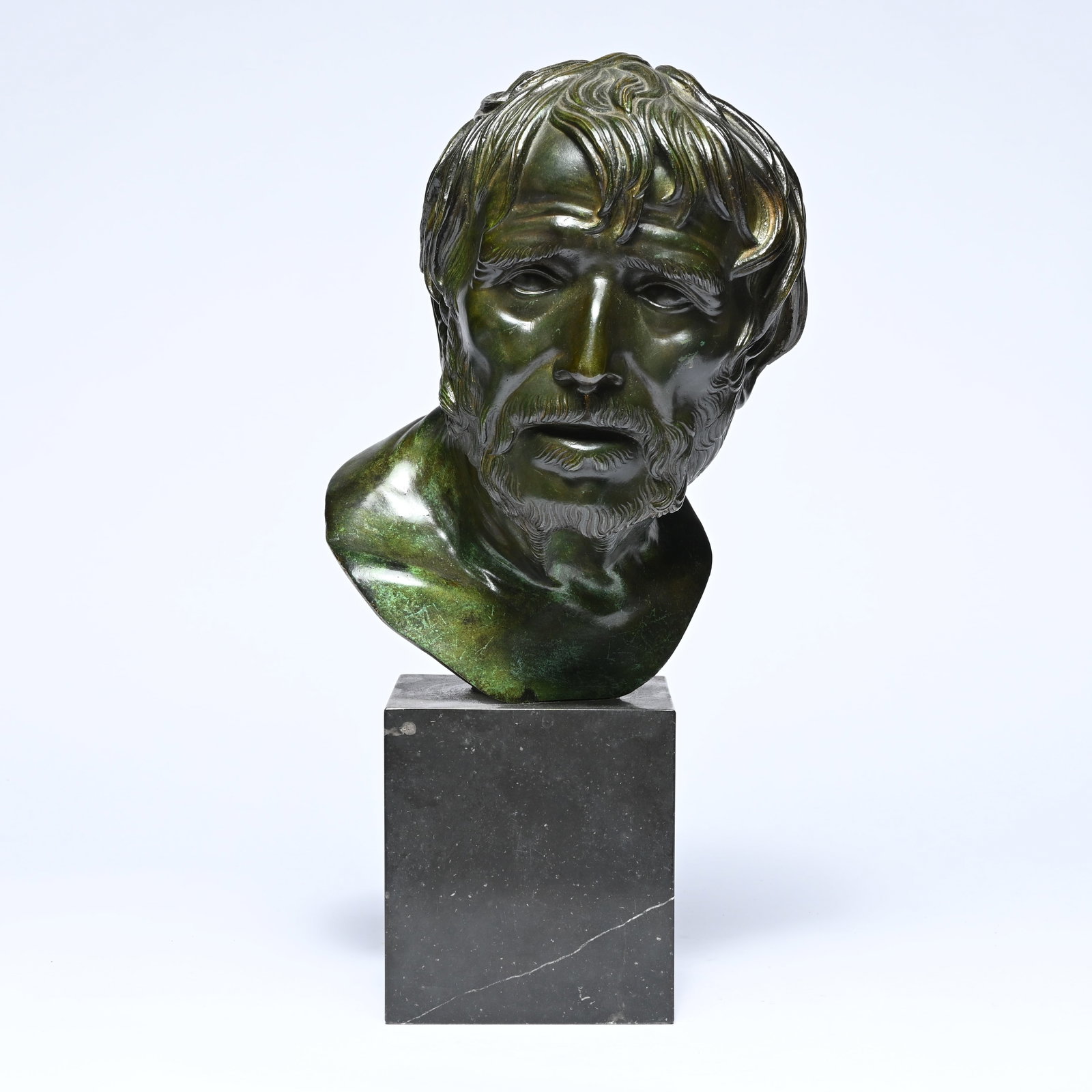 Green patinated bronze bust of the head of Pseudo-Seneca on a marble base, 'Grand Tour' replica (1 of 6)