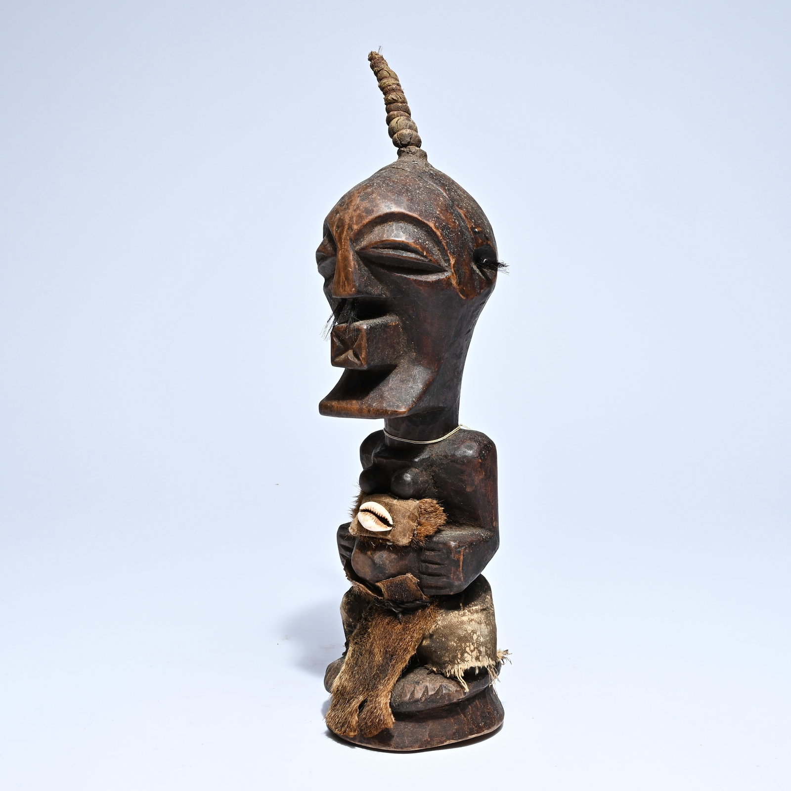Congo, wooden sculpture with a shell and remnants of animal hide. Probably Songye, mid-20th century. (1 of 9)
