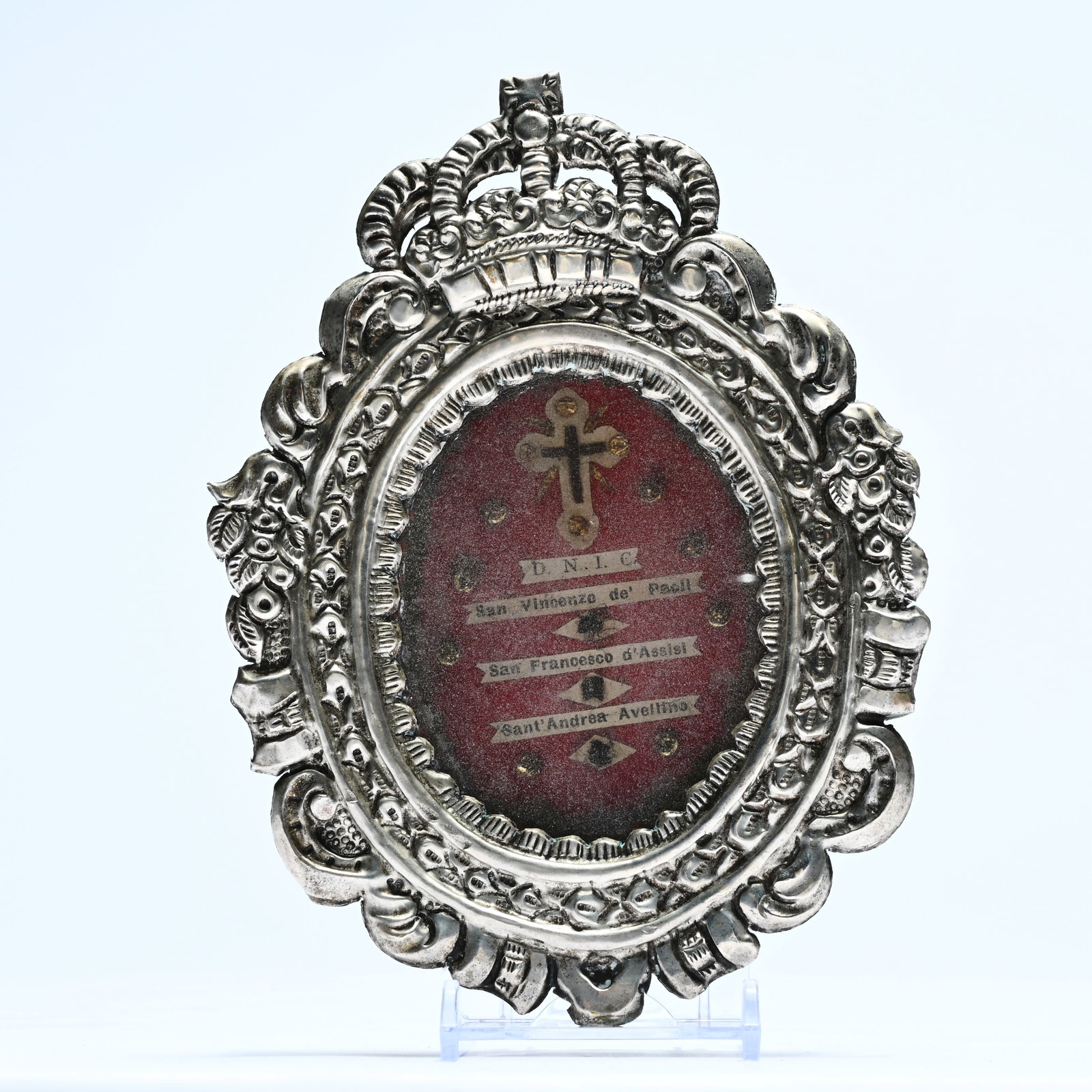 A sealed, silver-plated reliquary containing a relic of the Holy Cross (St. Vincent de Paul, St. (1 of 4)