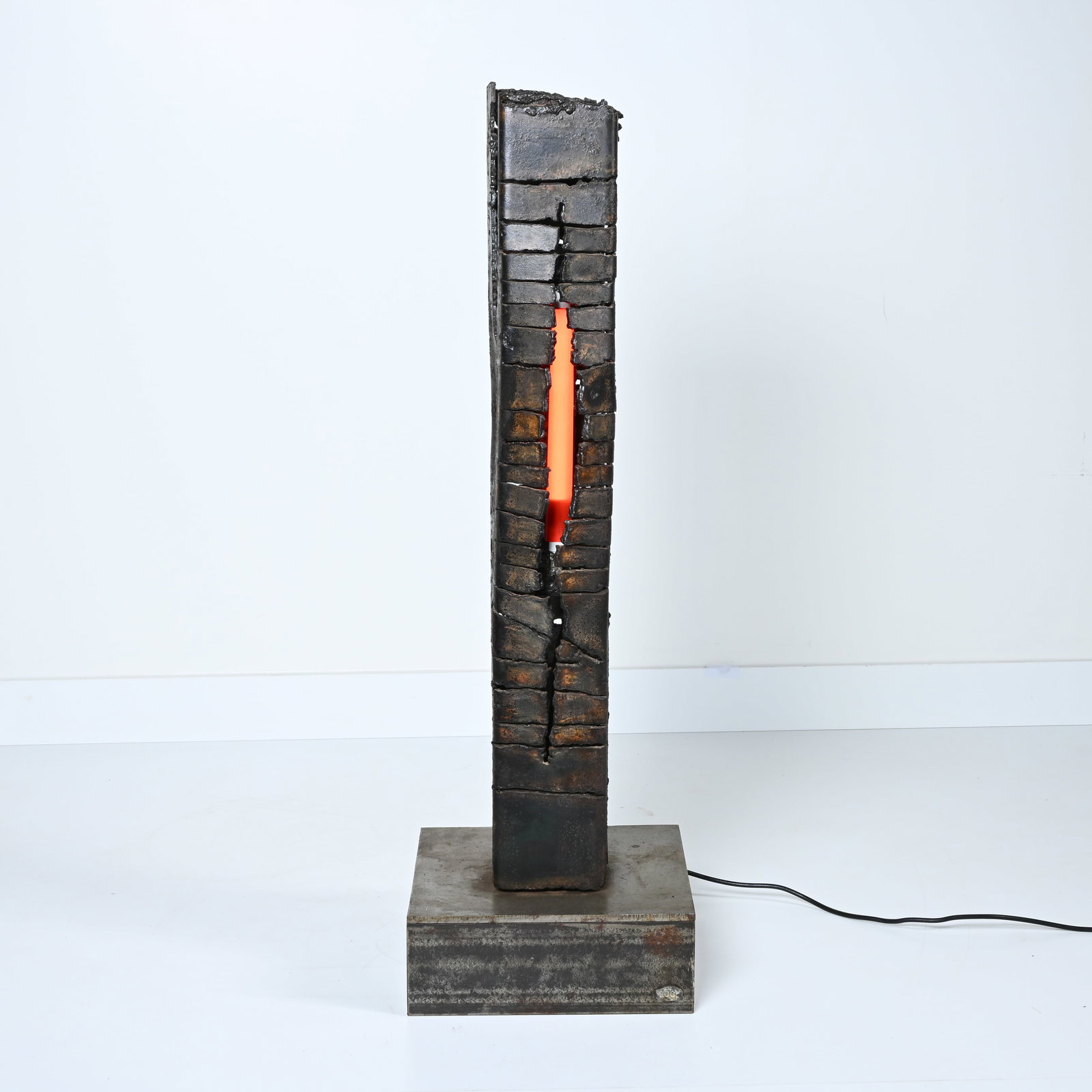 A brutalist floor lamp in bronze, designed by G. Collin, with monogram and a booklet with (1 of 8)