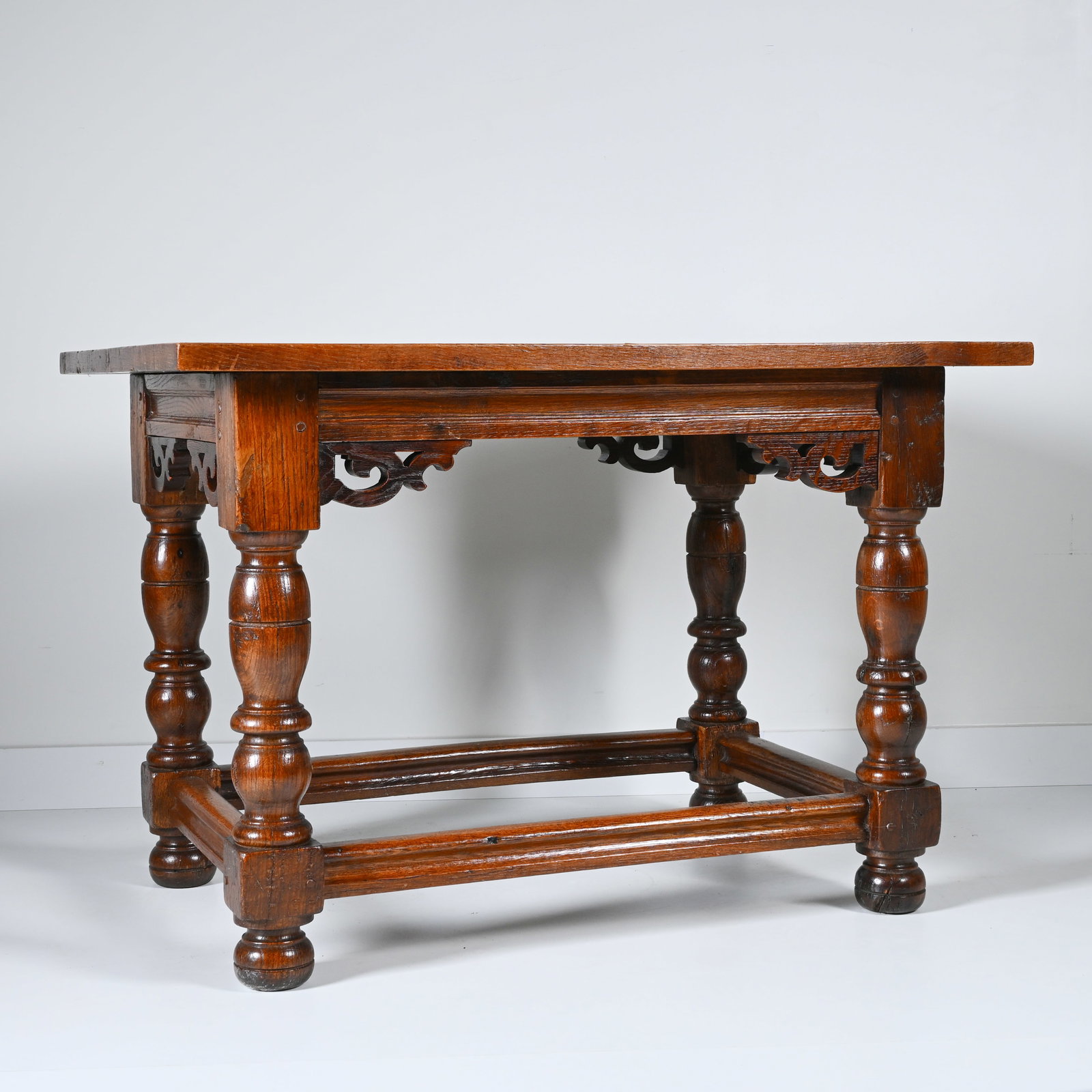 Solid oak Flemish writing desk with baluster legs and elegantly carved openwork ornaments, 18th (1 of 6)