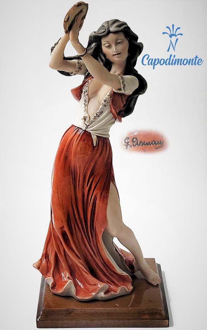 Gypsy Tambourine Dancer, A Large Very Rare Capodimonte G. Armani Signed Sculpture: Gypsy Tambourine Dancer, A Very Rare Italian Florence Capodimonte Giuseppe Armani Signed Hand Painted Porcelain Figurine On Wooden Base, Capodimonte Hallmarked. Circa 1980's. H 13.75" x 5.75" x 6"