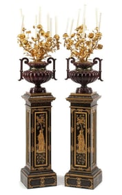 A Pair of French Enameled Cast Iron and Gilt Bronze Candelabra with Associated Painted Pedestals
