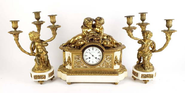 A 19th C. Tiffany & Co. Gilt Bronze & Marble Figural Clockset: A 19th C. Tiffany & Co. Gilt Bronze & Marble Figural Clockset. The clock measures H: 14 3/4" W: 16 1/4" and the candelabras measure H: 15 1/4" W: 11 1/4"