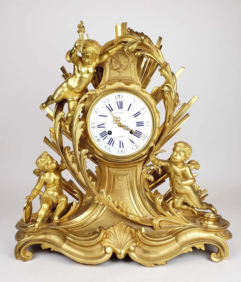 19th C. Raingo Freres French Gilt Bronze Mantle Clock: 19th C. Raingo Freres French Gilt Bronze Mantle Clock. Measures H: 22 1/2" W: 21 1/2"