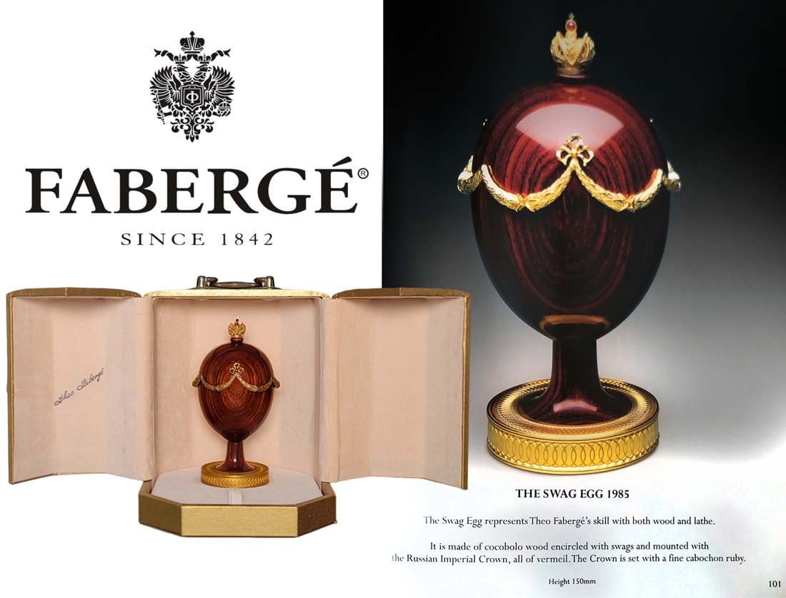Numbered #105 Cocobolo Wood With Ruby Cabochon Mounted Crown ' The Swag Egg 1985 ' Faberge Egg: Numbered #105 Cocobolo Wood With Ruby Cabochon Mounted Crown ' The Swag Egg 1985 ' Faberge Egg. H 6"