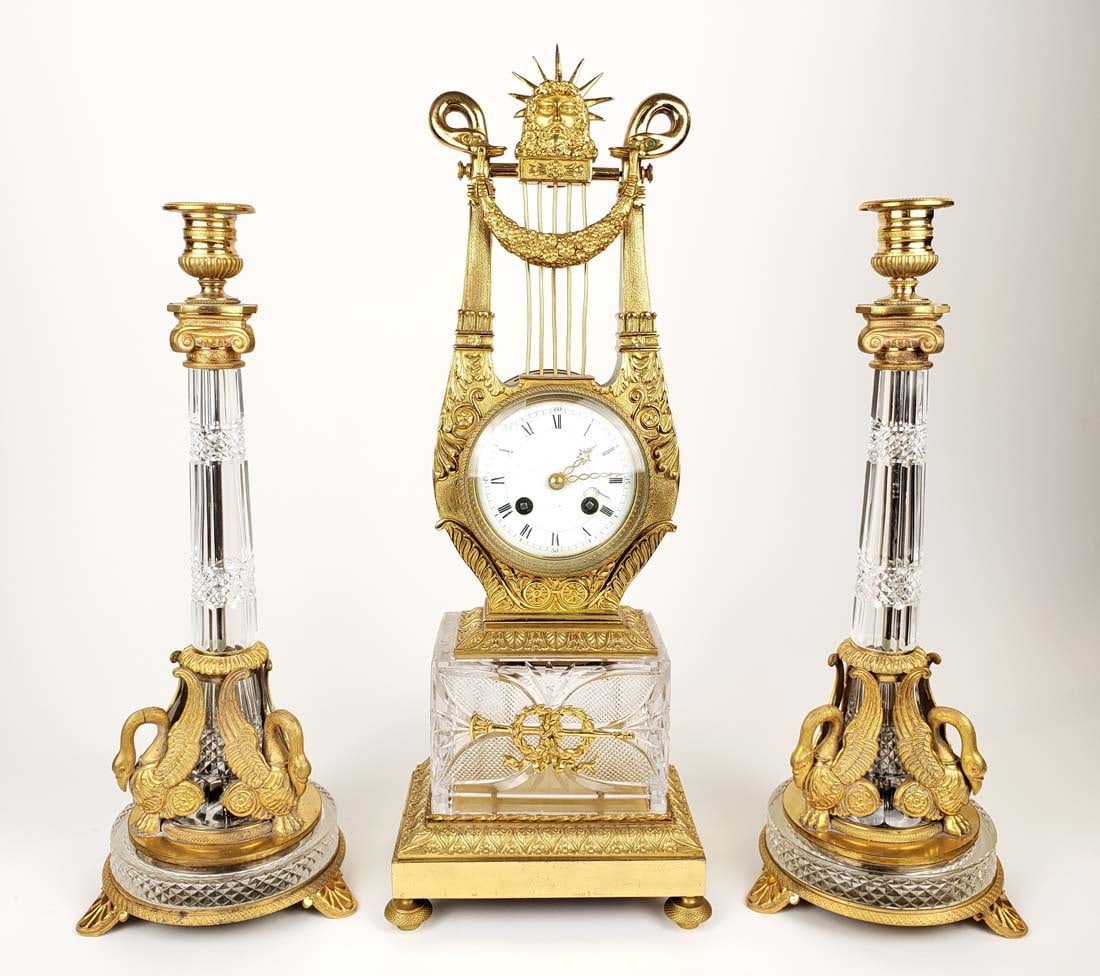 19th C. Empire Gilt Bronze & Crystal Clockset: 19th C. Empire Gilt Bronze & Crystal Clockset. The clock measures H: 19 1/2" W: 7 1/4" and the candelabras measure H: 15 1/2" W: 6 1/4"