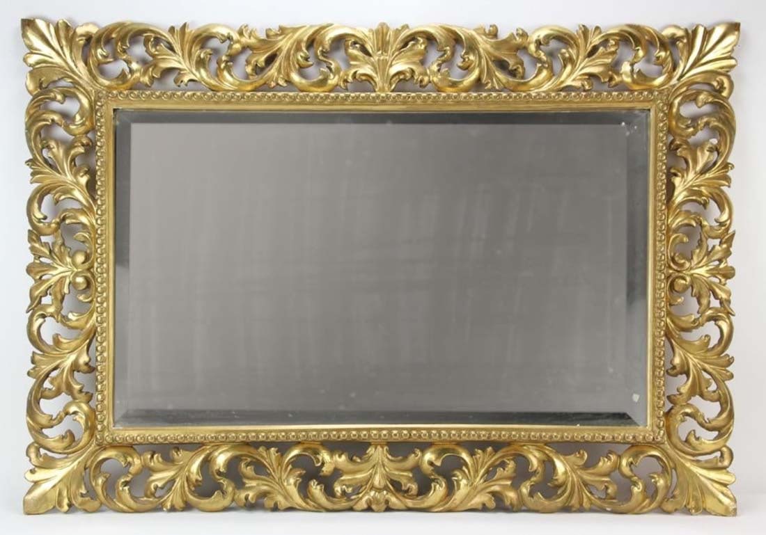 19th C Italian Rococo Giltwood Mirror: 19th C Italian Rococo Giltwood Mirror. Measures 39" x 28".