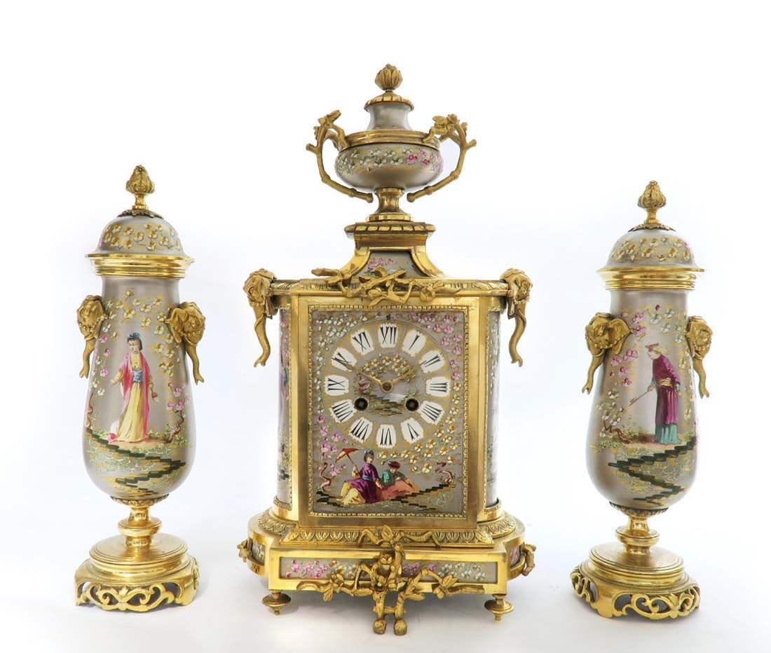 19th C. French Chinoiserie Bronze & Porcelain Clock Set: 19th C. French Chinoiserie Bronze & Porcelain Clock Set. The clock measures H: 16" W: 5 1/2" and the vases measure H: 13" W: 3 1/2"