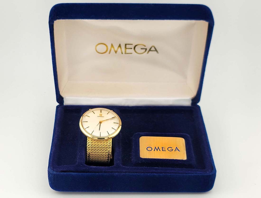 Omega 18k Yellow Gold Unisex Watch: Omega 18k Yellow Gold Unisex Watch. Uncut Original Strap With Mechanical Hand Wind Movement.