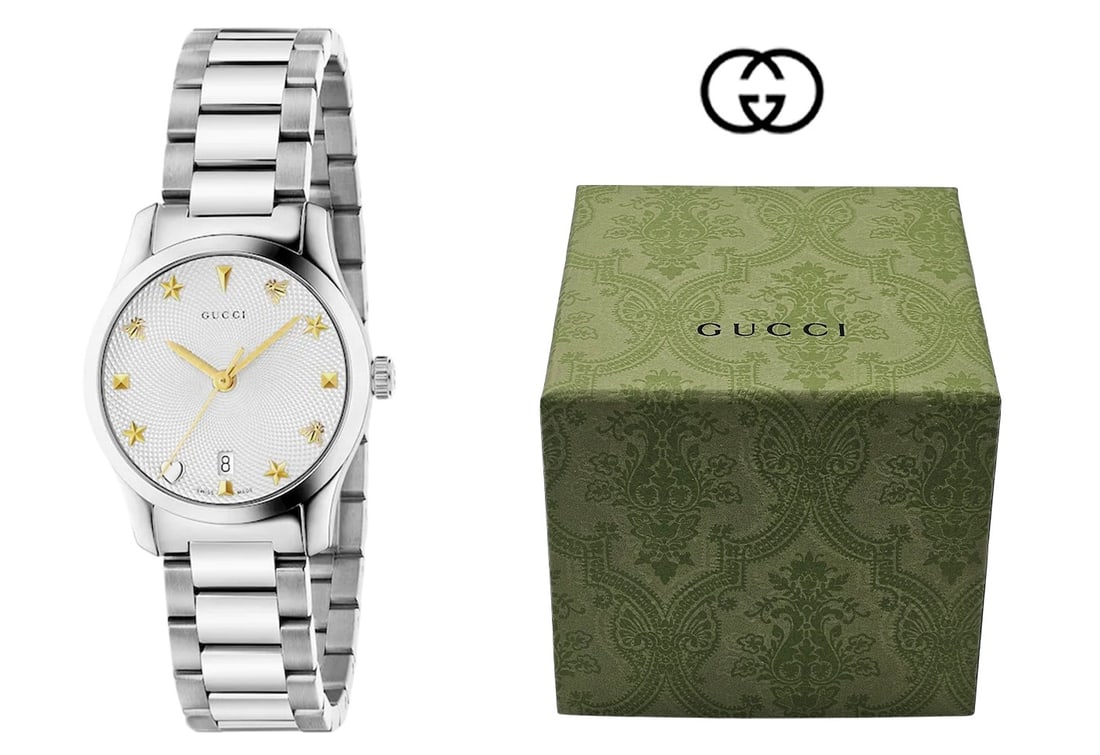 Gucci Women's G-timeless Stainless Steel Watch: Gucci Women's G-timeless Stainless Steel Watch. Quartz movement, water resistance: 5 ATM (160 feet/50 meters). Wrist size adjustable from 146mm to 176mm. Swiss Made (27mm) Box: H 4 1/4" x W 5"