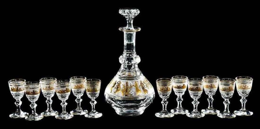 A 13 Pc. Val St. Lambert "Danse de Flore" Cordial Set: A 13 Pc. Val St. Lambert "Danse de Flore" Cordial Set. hand blown crystal decanter with gilded cameo decoration of a procession of classical figures, together with 12 cordials, gilded etched band of