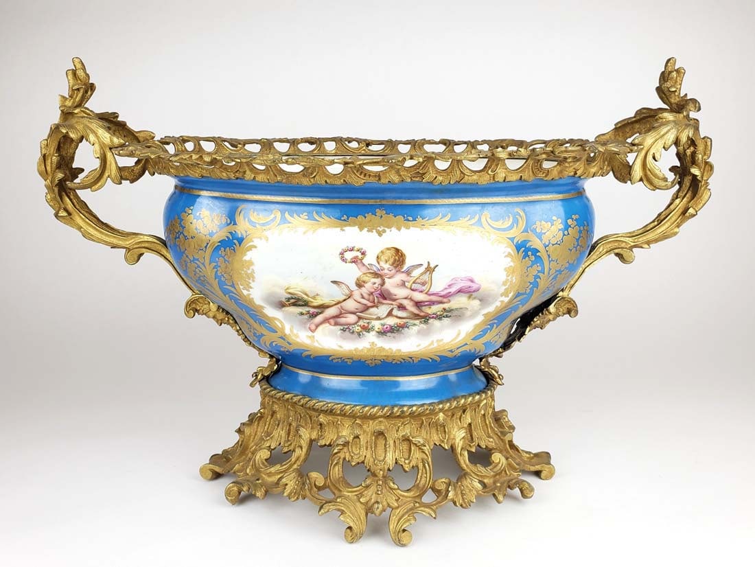 19th C. Large Sevres French Porecelain & Bronze Centerpiece: 19th C. Large Sevres French Porecelain & Bronze Centerpiece. Measures H: 14" W: 22"