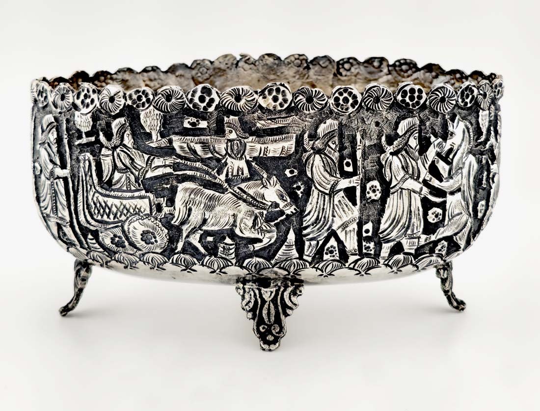 Antique Persian Shiraz .84 Silver Basket: Antique Persian Shiraz .84 Silver Basket. (255g) Featuring intricate repousse decorations of scenes similar to those found in Persepolis, Cyrus the Great. 5" x 3" x 3"