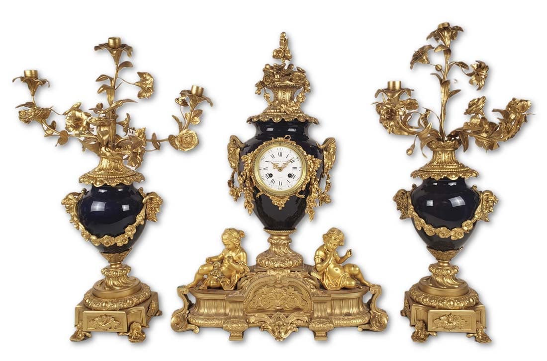 19th C. Tiffany & Co. Sevres Porcelain & Bronze Clockset: 19th C. Tiffany & Co. Sevres Porcelain & Bronze Clockset. The clock measures H: 26 3/4" W: 20 1/4" and the candelabras measure H: 26" W: 17 1/4"