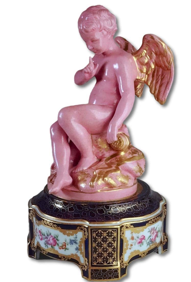 Sevres Porcelain Falconet Cupid L'amour Menacant: Falconet Cupid L'amour Menaant Sevres Porcelain Rare Pink Pompadour StatueOn typical Sevres cobalt painted base, is attributed to Sevres; the Cupid, which is most commonly seen in white bisque, much r