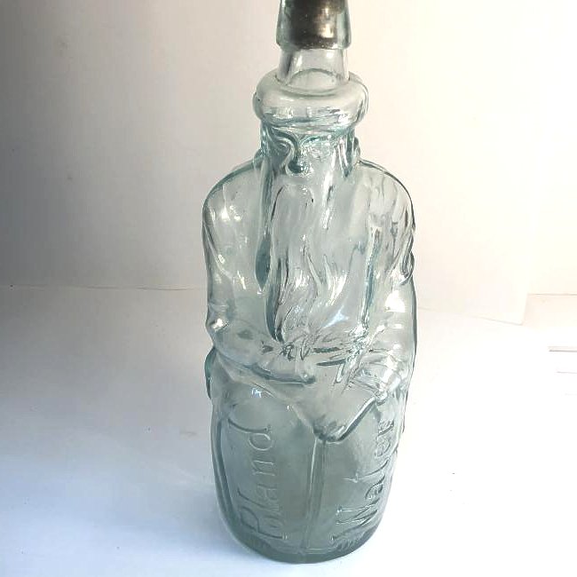 1870's Aqua Moses Poland Spring Bottle: An original 1870's Poland Spring Moses bottle. Embossed front and back and has the crude applied lip.