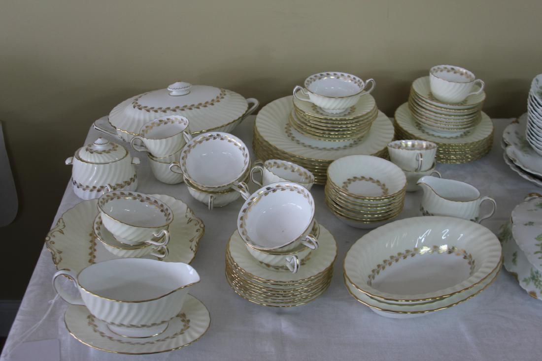69 Pieces Minton China Cheviot Gold: Minton Bone China in the Cheviot Gold Pattern. Dated on bottom 1960 - 69 Pieces total. No damage found - this set appears to be in exceptional condition with little use.7 tea cups 8 saucers 2 two hand