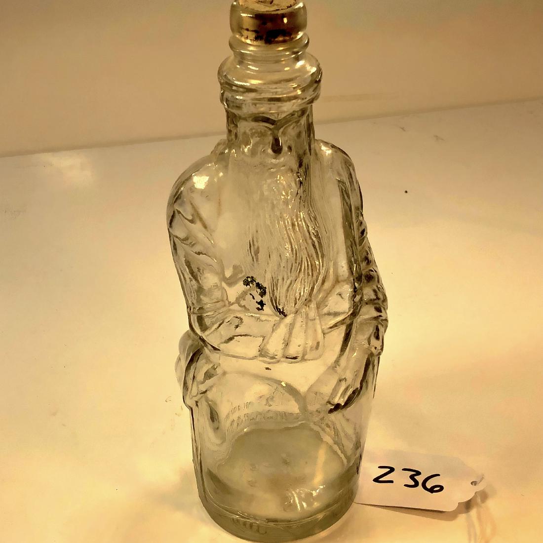 Poland Water Co Moses reproduction liquer bottle: Ricker And Sons corked Moses liquer bottle. In good condition, Reads R-61 9 S 5 5 on bottom. Original cork. Measures 11" high.