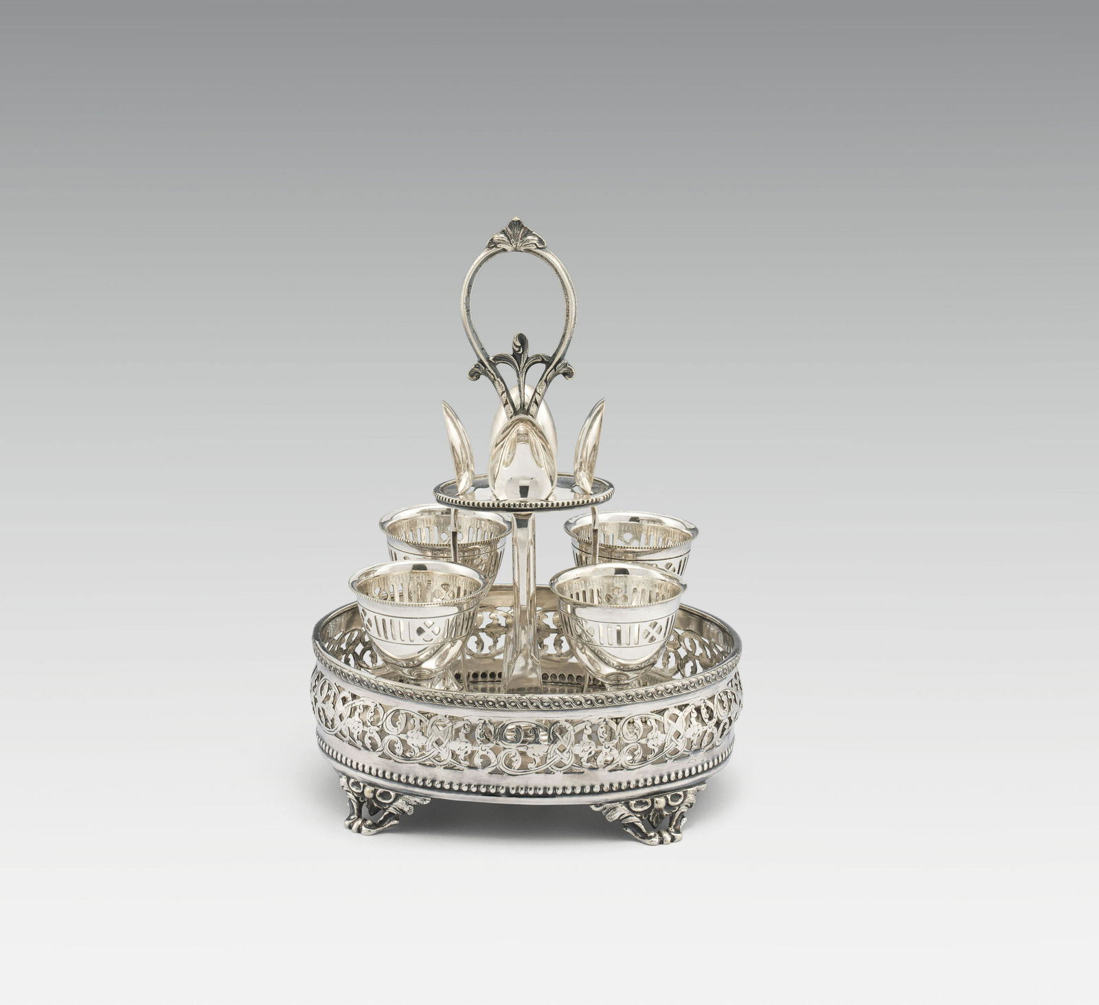 Egg Cup Setsilver; openwork; service, consisting of 4 egg cups and 4 spoons in matching holder;: Egg Cup Setsilver; openwork; service, consisting of 4 egg cups and 4 spoons in matching holder; holder and spoons marked: "JS&S", for John Sherwood & Sons, beaver, crown and date letter "B"h. 22 cm, h