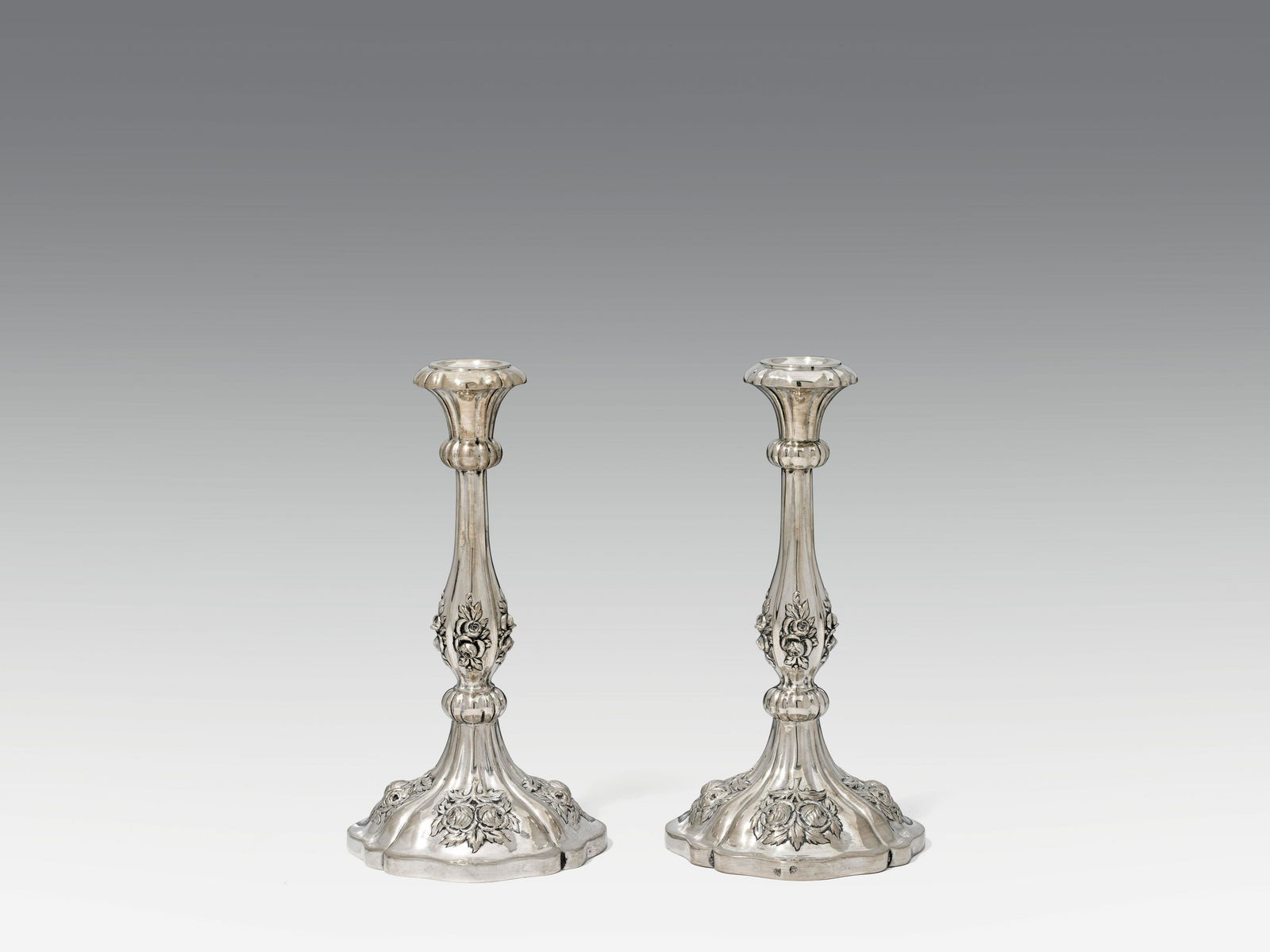 Pair of Candlesticksilver, remains of old gilding; marked on the side: Budapest hallmark "1833" and: Pair of Candlesticksilver, remains of old gilding; marked on the side: Budapest hallmark "1833" and mark "JM", for Josephus MÃ¼ller (see: ElemÃ©r, Merkzeichen der Goldschmiede Ungarns, p. 84)h. 26