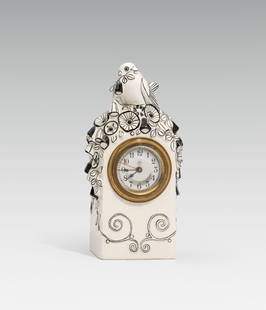 Michael Powolny: Clock with sparrow: Michael Powolny Clock with sparrow ceramics, light shard, painted and glazed in black and white; marked on the bottom with the mark of Vereinigte Wiener und Gmundner Keramik and model no. "85"; metal