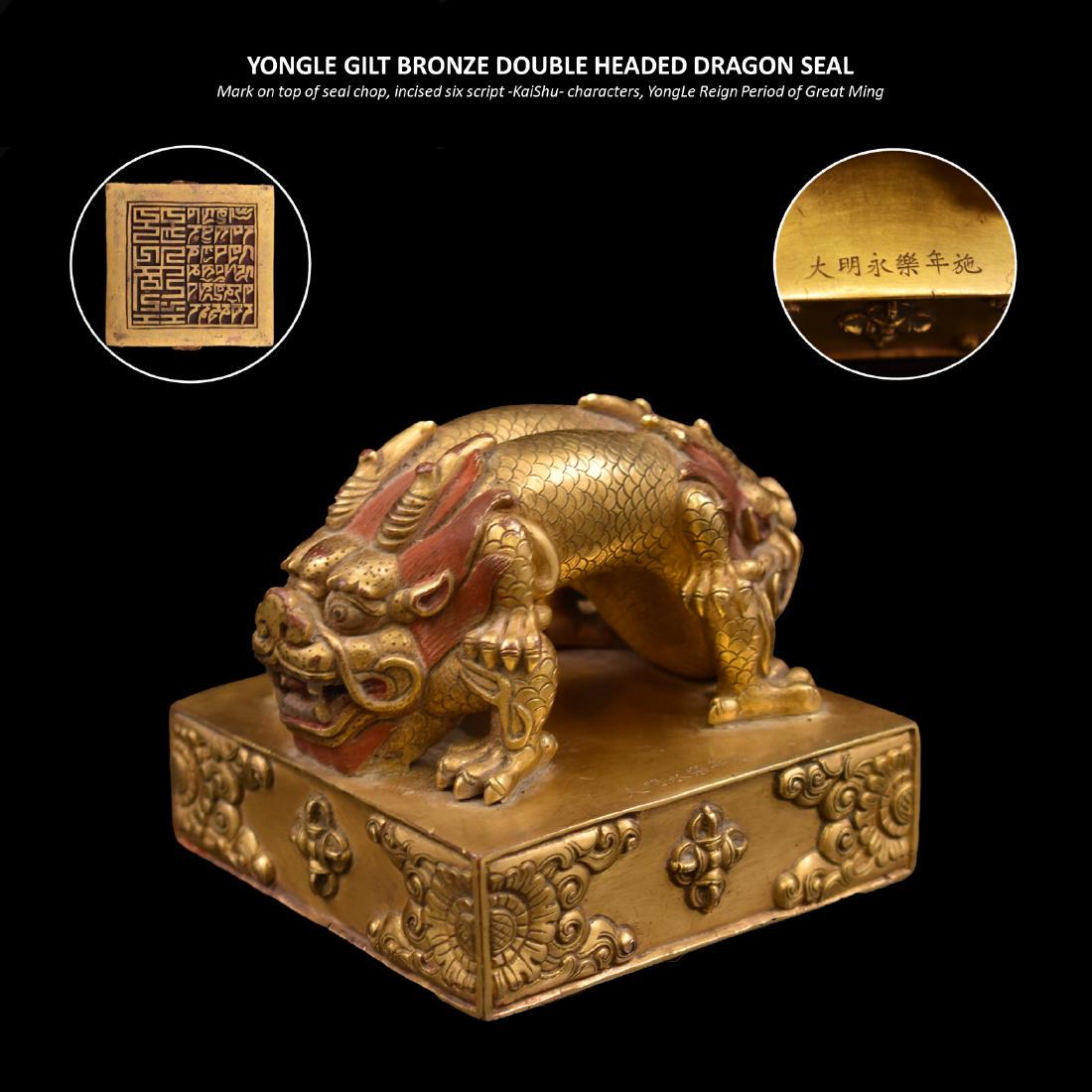YONGLE GILT BRONZE DOUBLE HEADED DRAGON SEAL: YONGLE GILT BRONZE DOUBLE HEADED DRAGON SEAL Stunning Chinese Ming Dynasty Gilt Bronze seal with double headed double-horned dragon handgrip, lined with raised embellishments. A cuboid slab of rich qu
