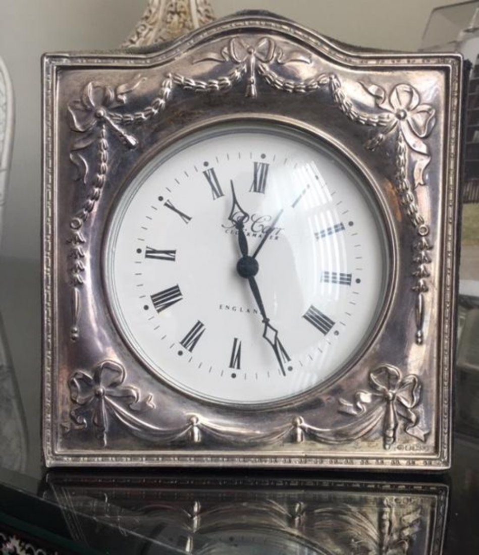 R. Carr English Sterling Silver Clock Hechinger: R. Carr English Sterling Silver Clock with Hechinger West Germany Quartz Movement. Measures 6"H x 5.5."W. In house shipping is available, buyer pays shipping cost.