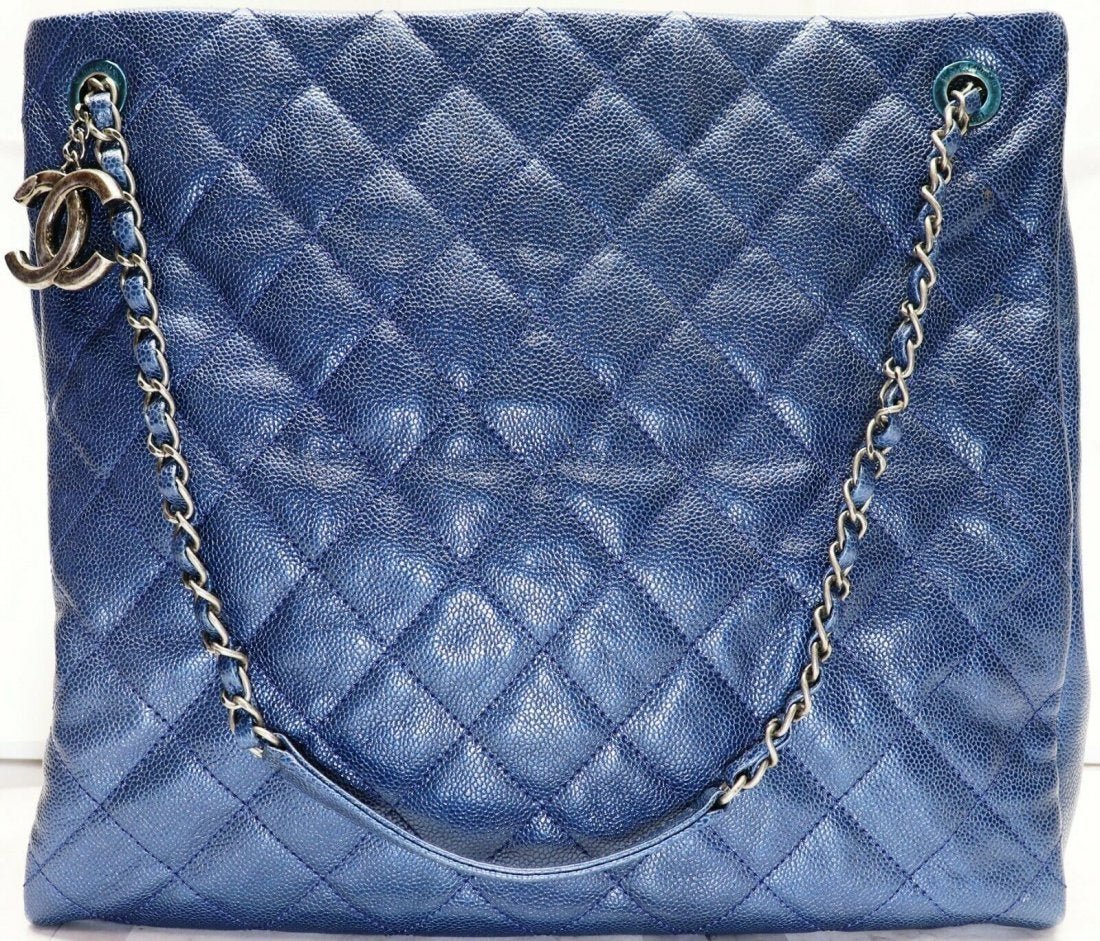 Chanel Metallic Blue Quilted Caviar Leather Tote Bag: Chanel Metallic Blue Quilted Caviar Leather Chic Shopping Tote Bag. Made in Italy. Measurements: 14" L x 6" W x 12" H. Strap drop 8". In house shipping to continental US $35.