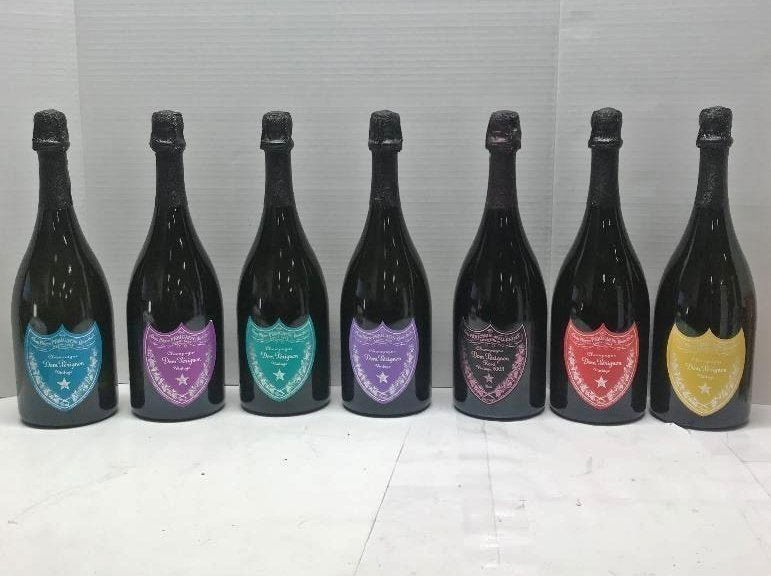 Andy Warhol Dom Perignon Collection of 7 Bottles: Rare Collection of 7 display bottles of Dom Perignon Champagne designed by Andy Warhol. All bottles are sealed. EMPTY bottles were created for a display and decoration. In house shipping to continenta