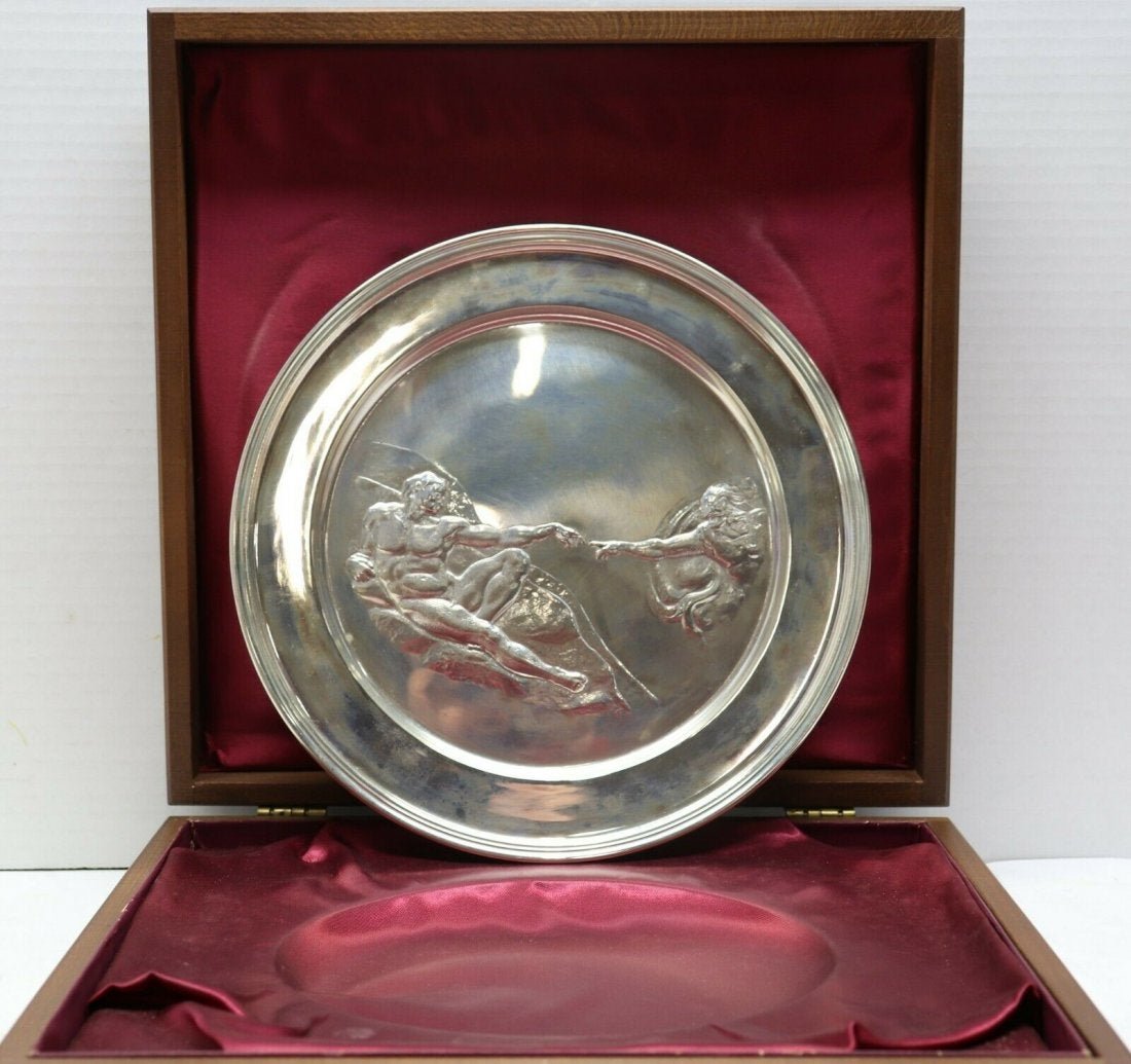 Richard Comyns English Sterling Silver Plate: After Michelangelo "Creation of Adam" by Richard Comyns English Sterling Silver Plate measures 9"dia. Weight 244.0 dwt / 379.5 grams. Model#2736. Comes with wooden box and papers. In house shipping to